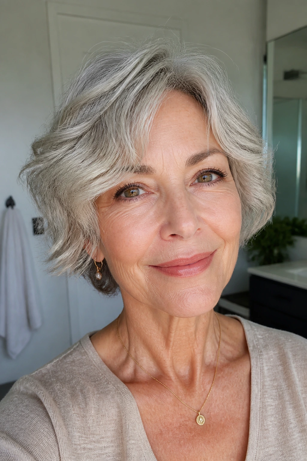 Close-up of a real woman with a fine-textured air-dried wavy cut