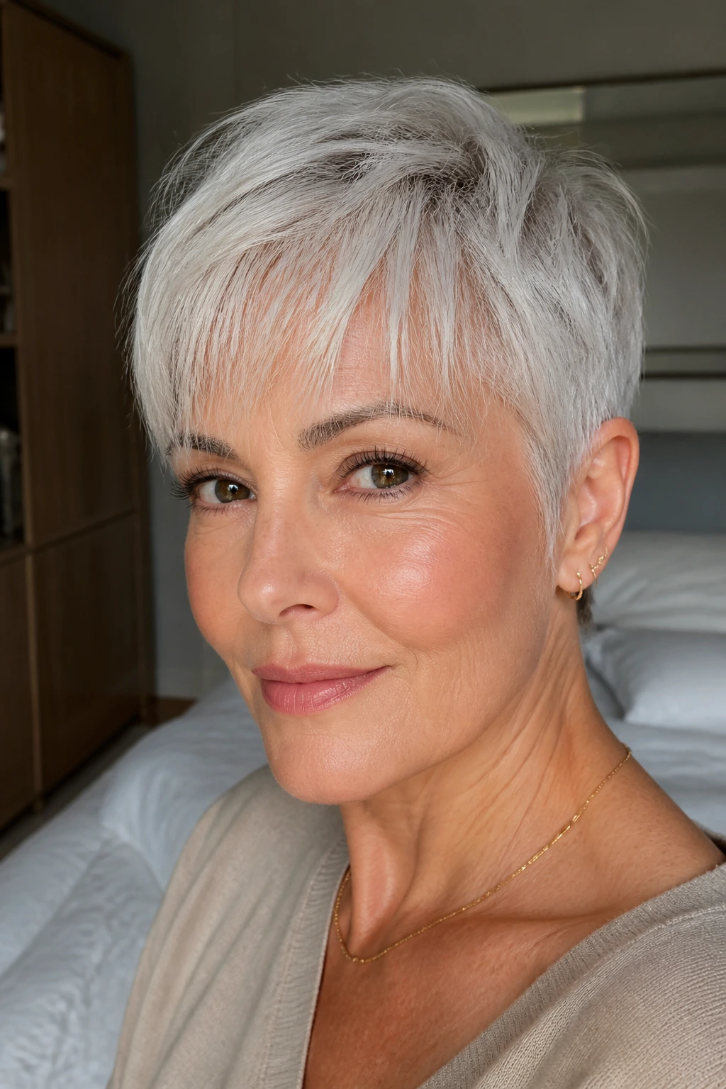 Close-up of a real person with a pearl pixie and airy bangs