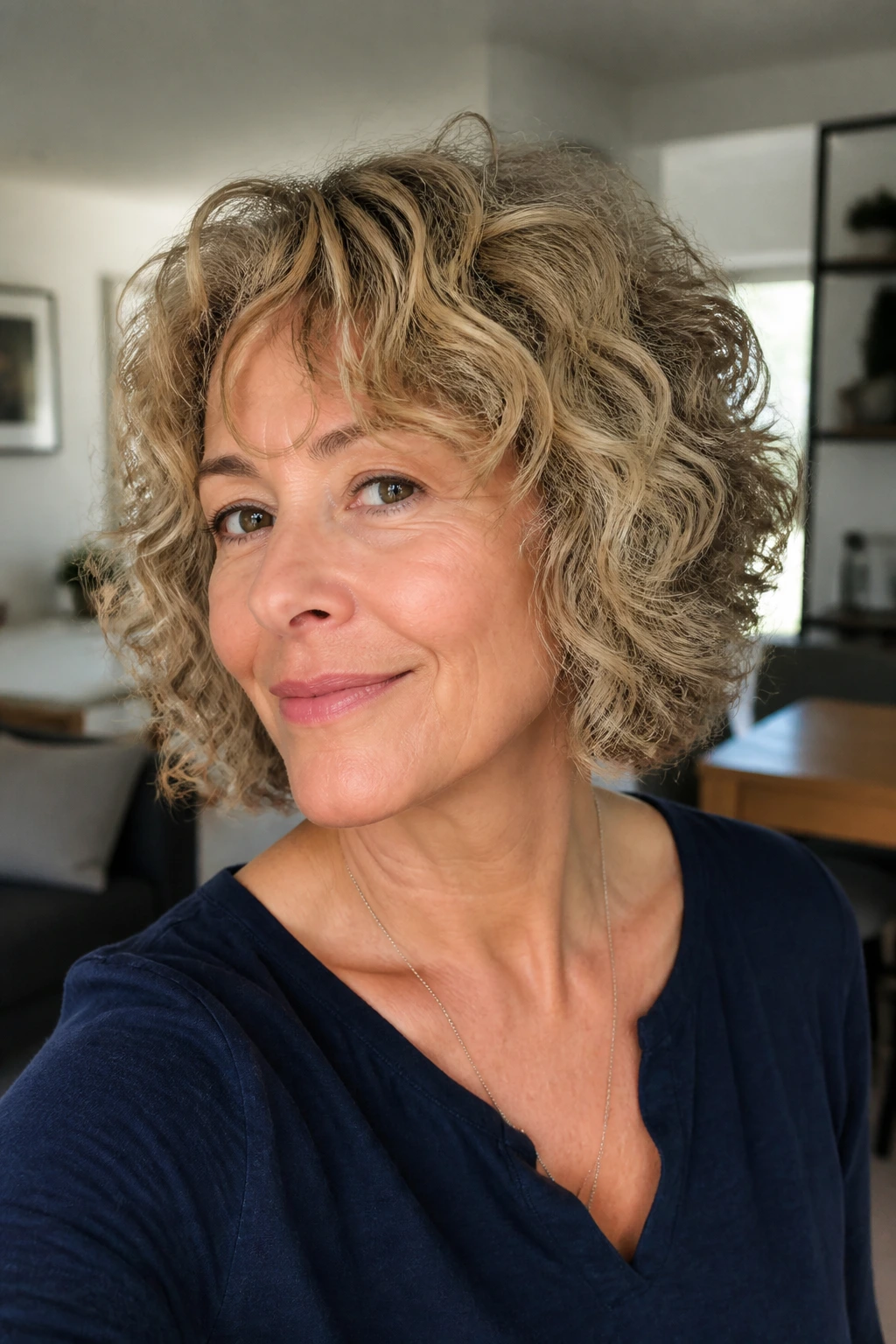 Close-up portrait of a real woman with airy shag-bob, light layers and soft curls