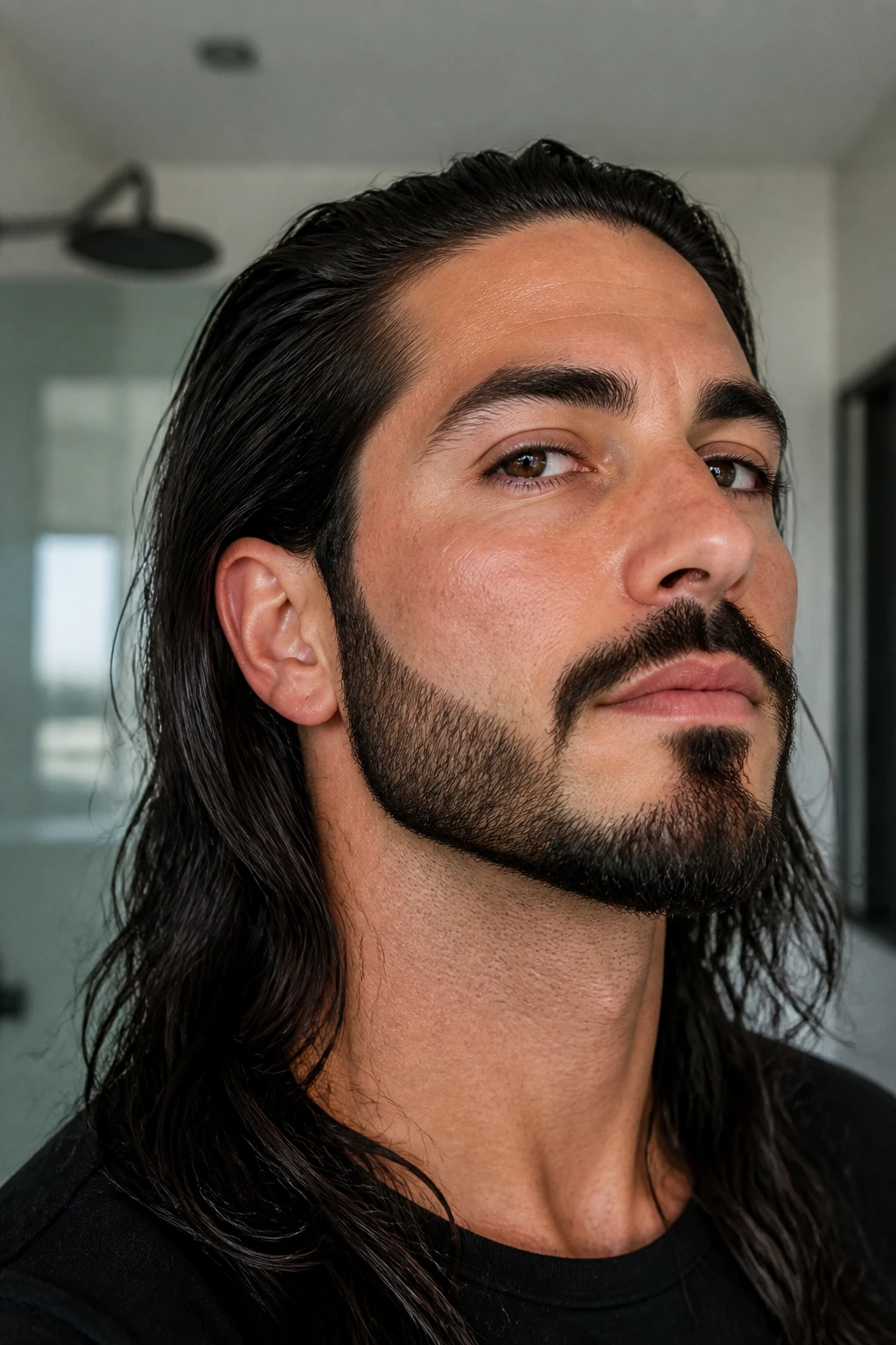 Close-up of a man wearing an anchor beard with a defined bottom edge and trimmed cheeks.