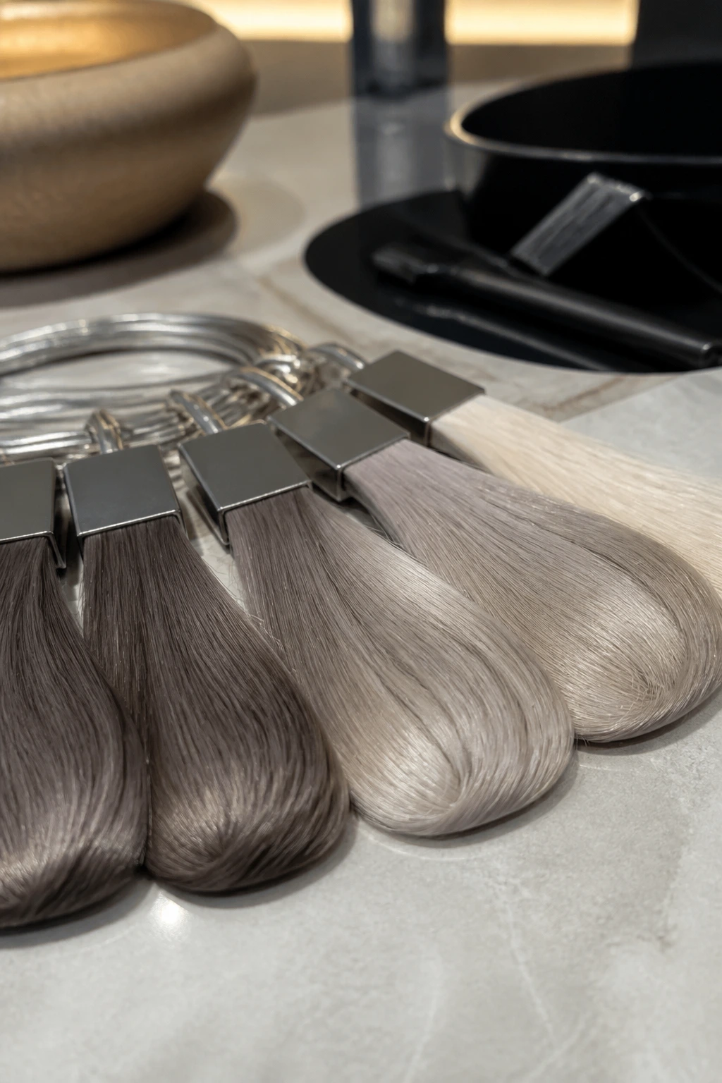 Row of ash-toned color swatches for dyes and toners