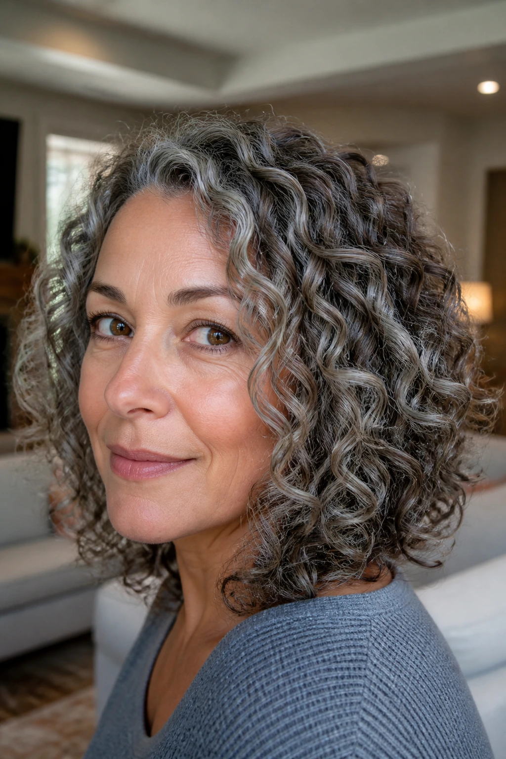 Close-up of Ash Ribbon Highlights on curls of a real woman