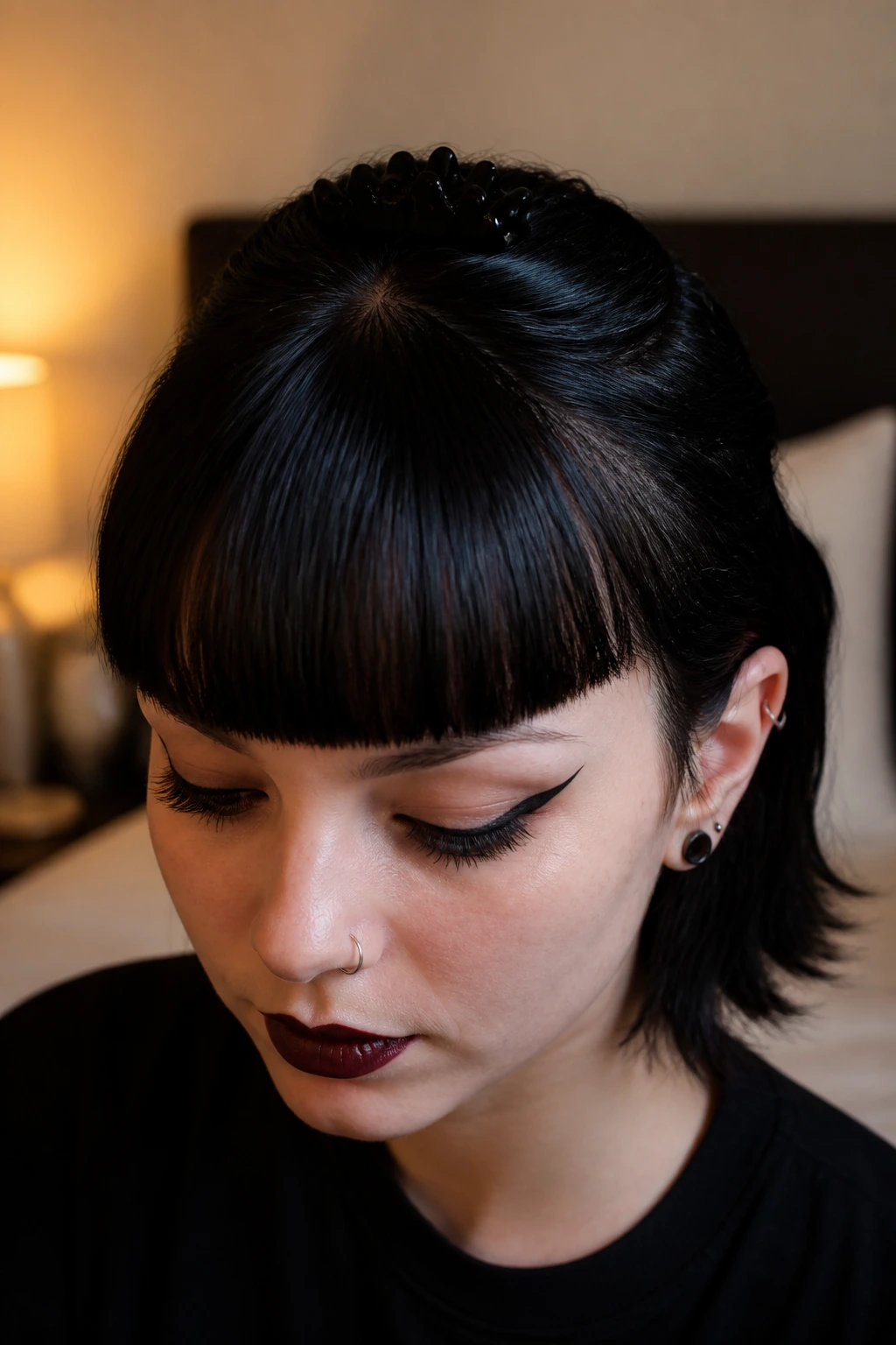 Portrait of a person with crisp bangs held by a crown clip
