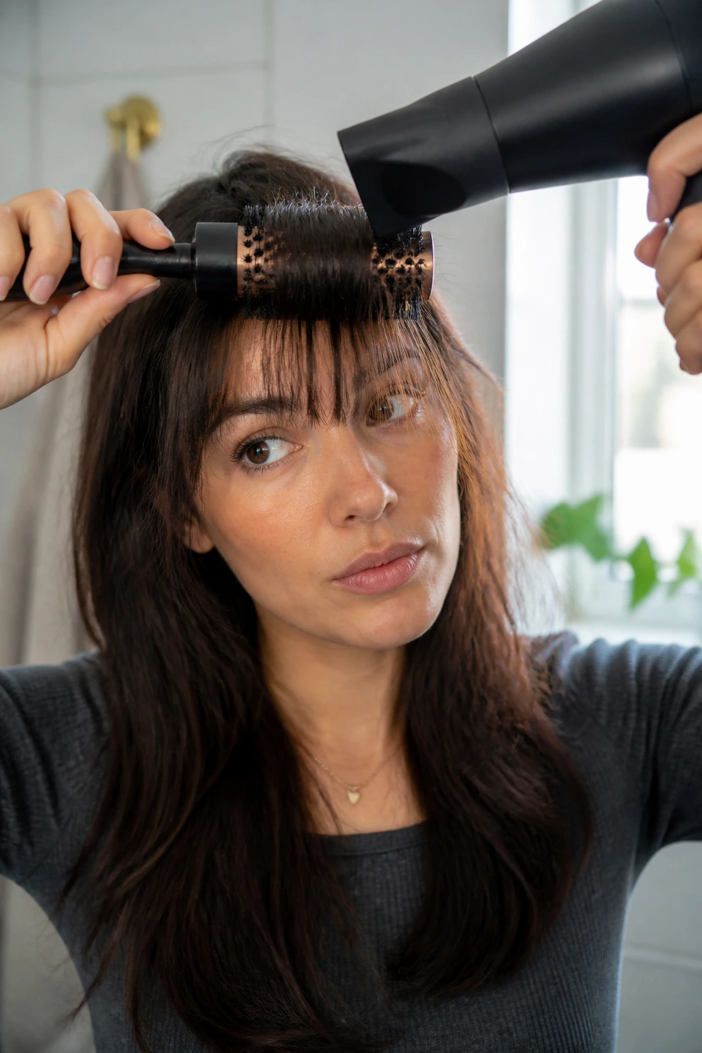 Real person styling bangs in a bathroom for busy mornings