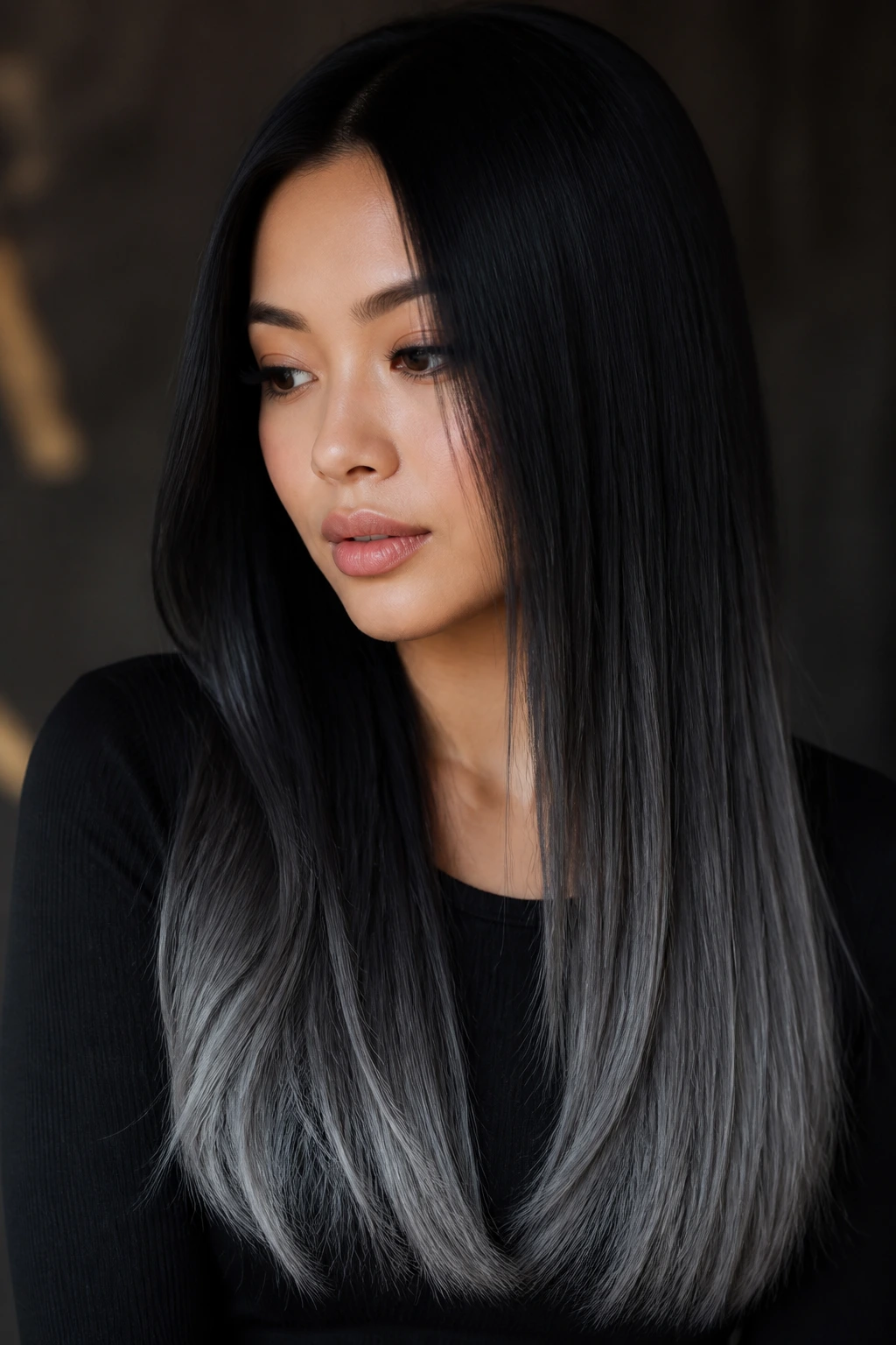 Close-up portrait of a real person with black to charcoal hair gradient
