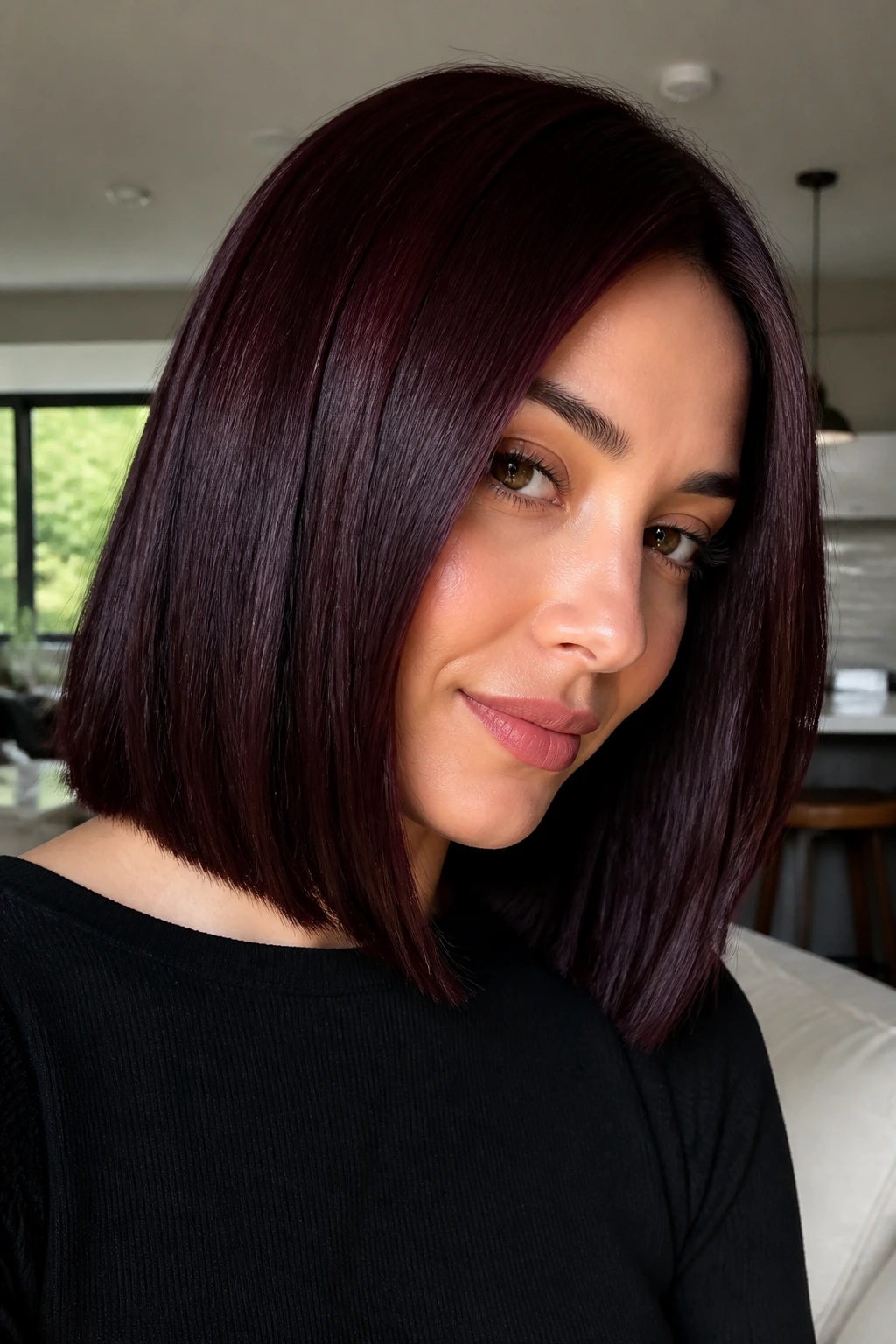 Close-up of a real woman with black cherry velvet hair and blunt cut