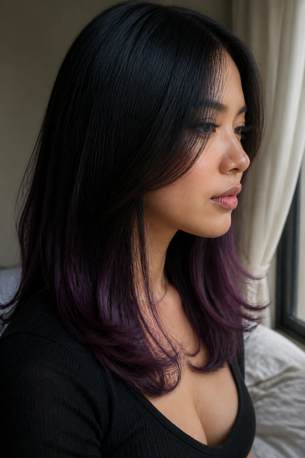 Close-up of black hair with violet ends on a real person