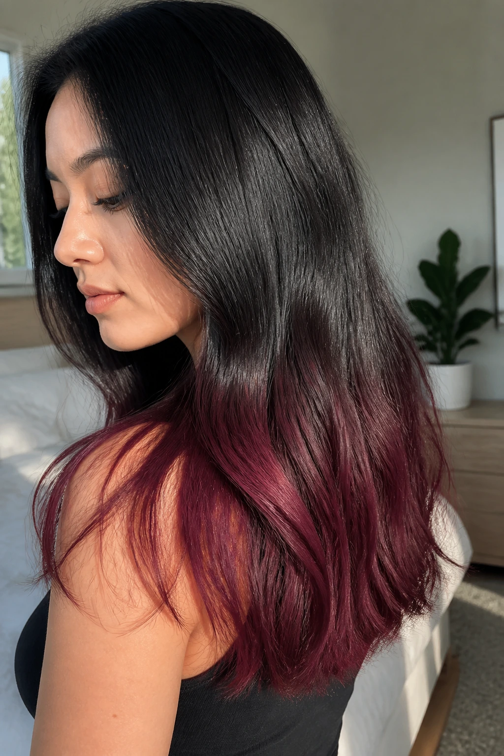 Close-up of a real woman with espresso to blackberry merlot dip-dye hair
