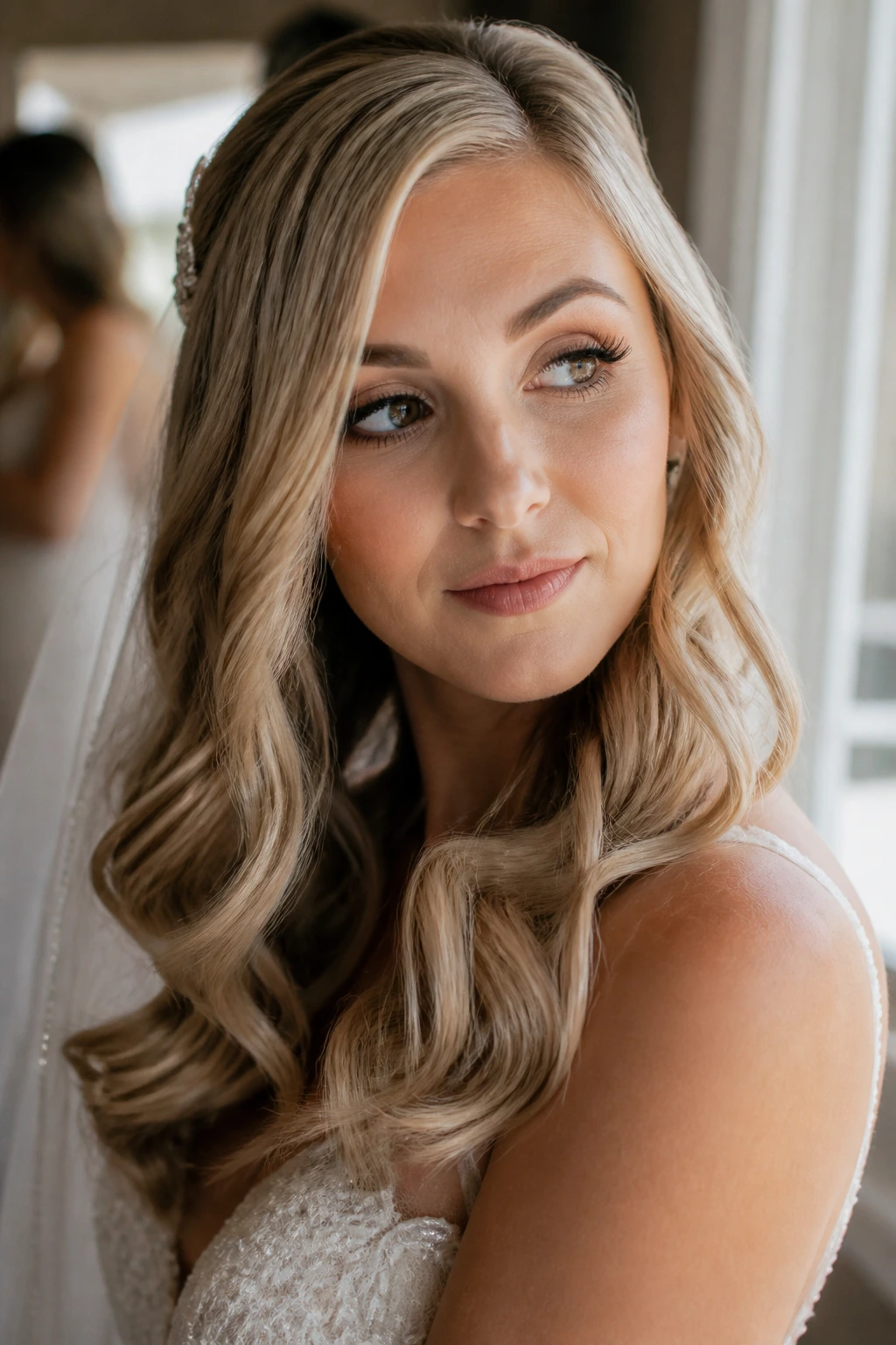 Close-up of a real bride with soft blonde waves and a thoughtful expression