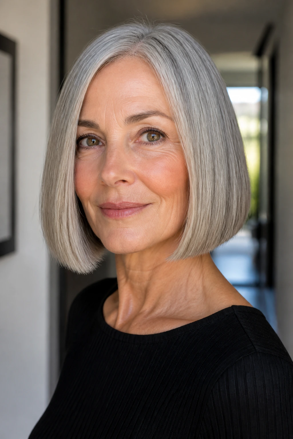 Close-up of a real woman with a sleek blunt bob and softened ends