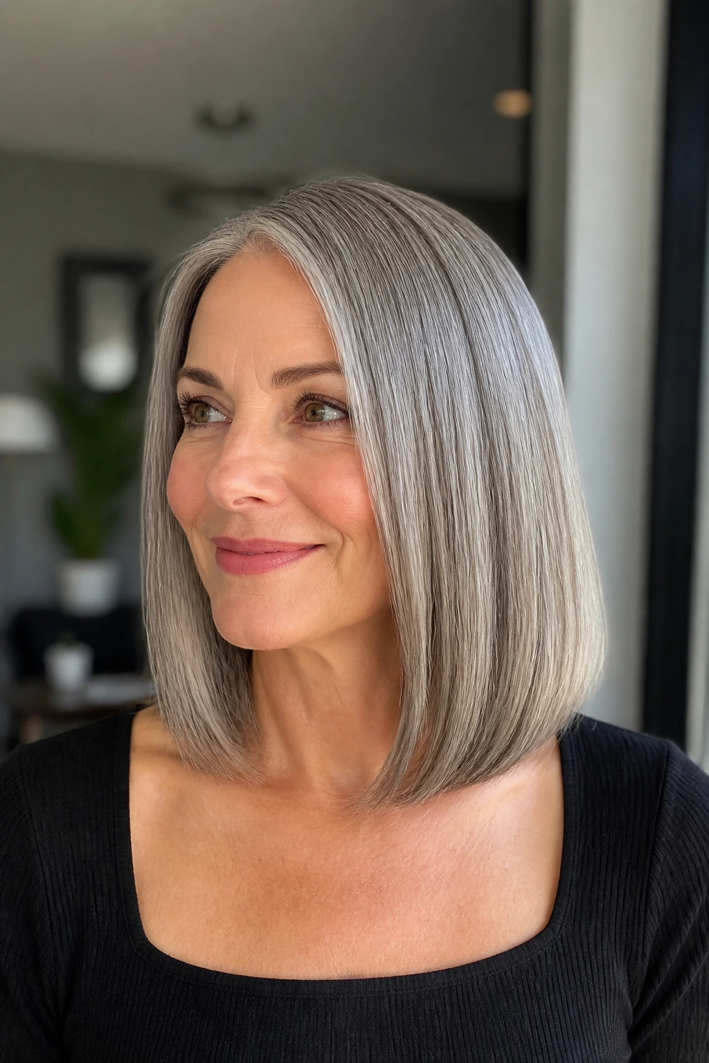 Close-up of a blunt collarbone cut with a glassy finish on gray hair