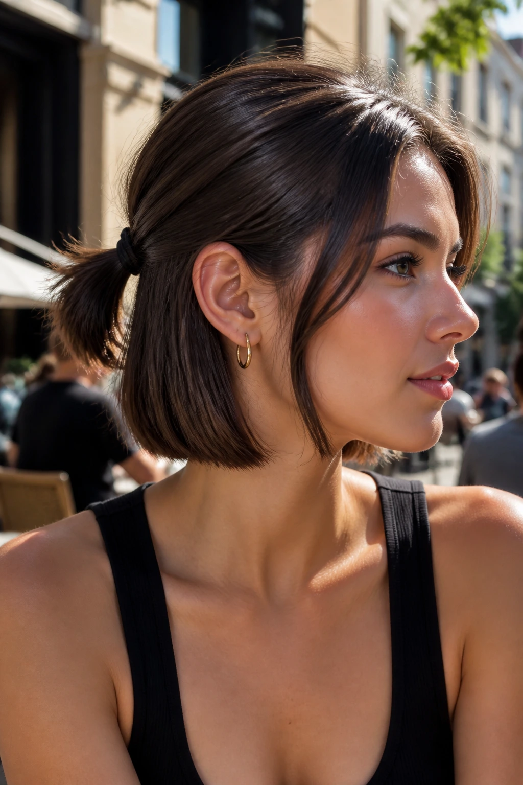 Real woman with bob and small mini ponytail at back, sunlit street backdrop.