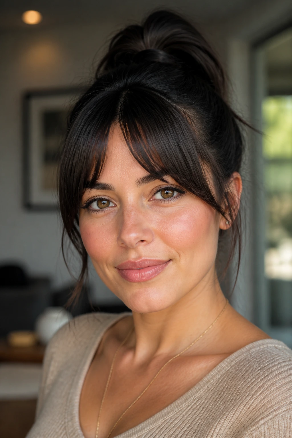 Close-up of a person with bottleneck bangs and a ponytail/updo