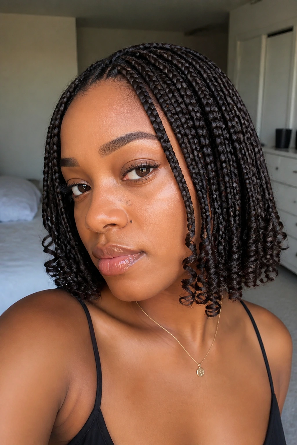 Close-up portrait of a real woman with curly ends on box braids