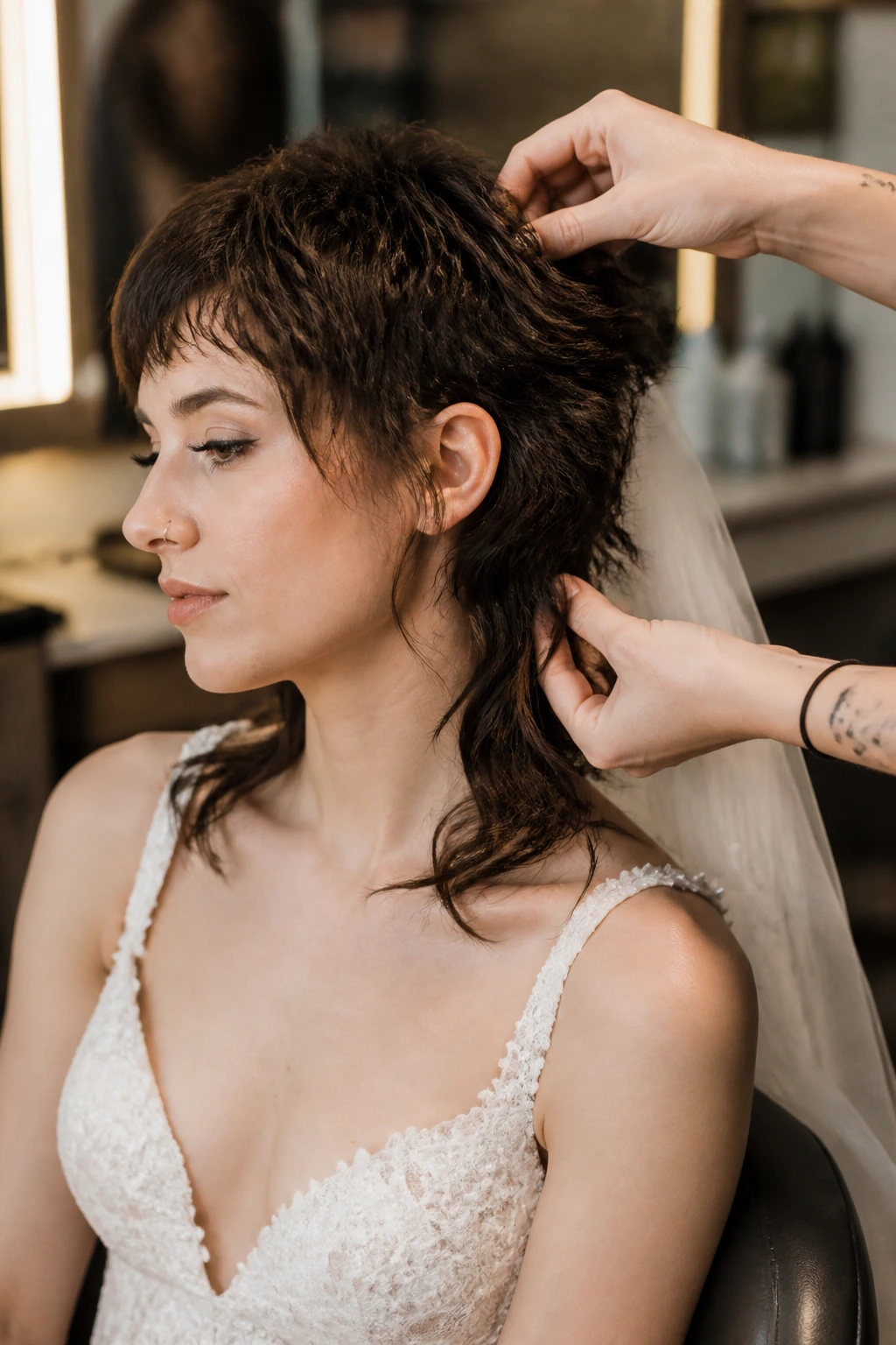 Bride in salon during mullet trial run and touch-up.