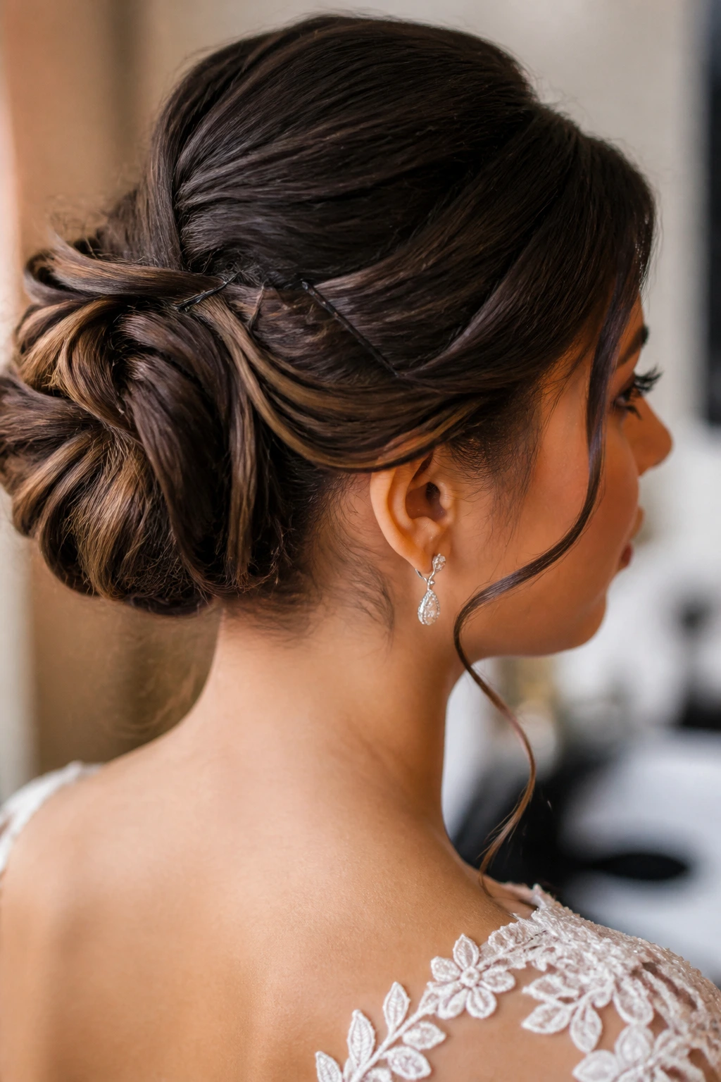 Close-up of real bride's updo with discreet pins securing sections