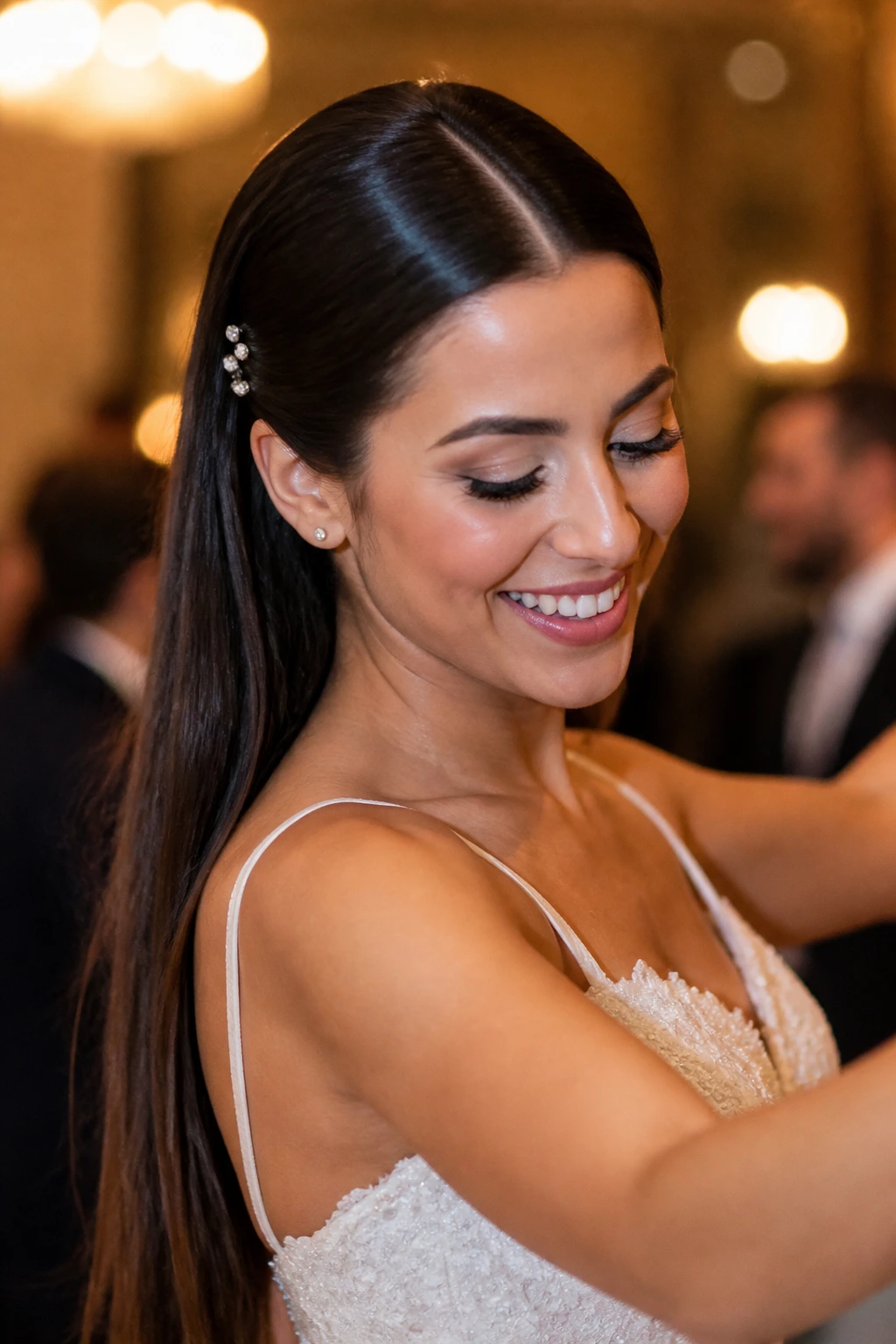 Bride with sleek straight hair remains in place during dancing in ballroom