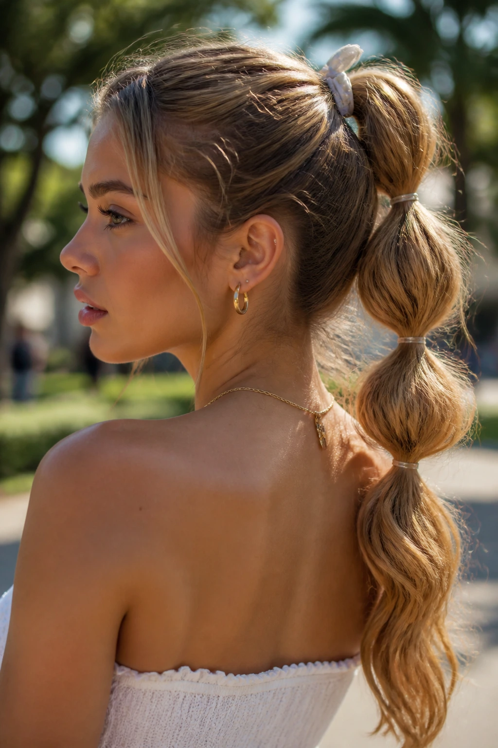 Real woman with bubble ponytail showing distinct bubbles.