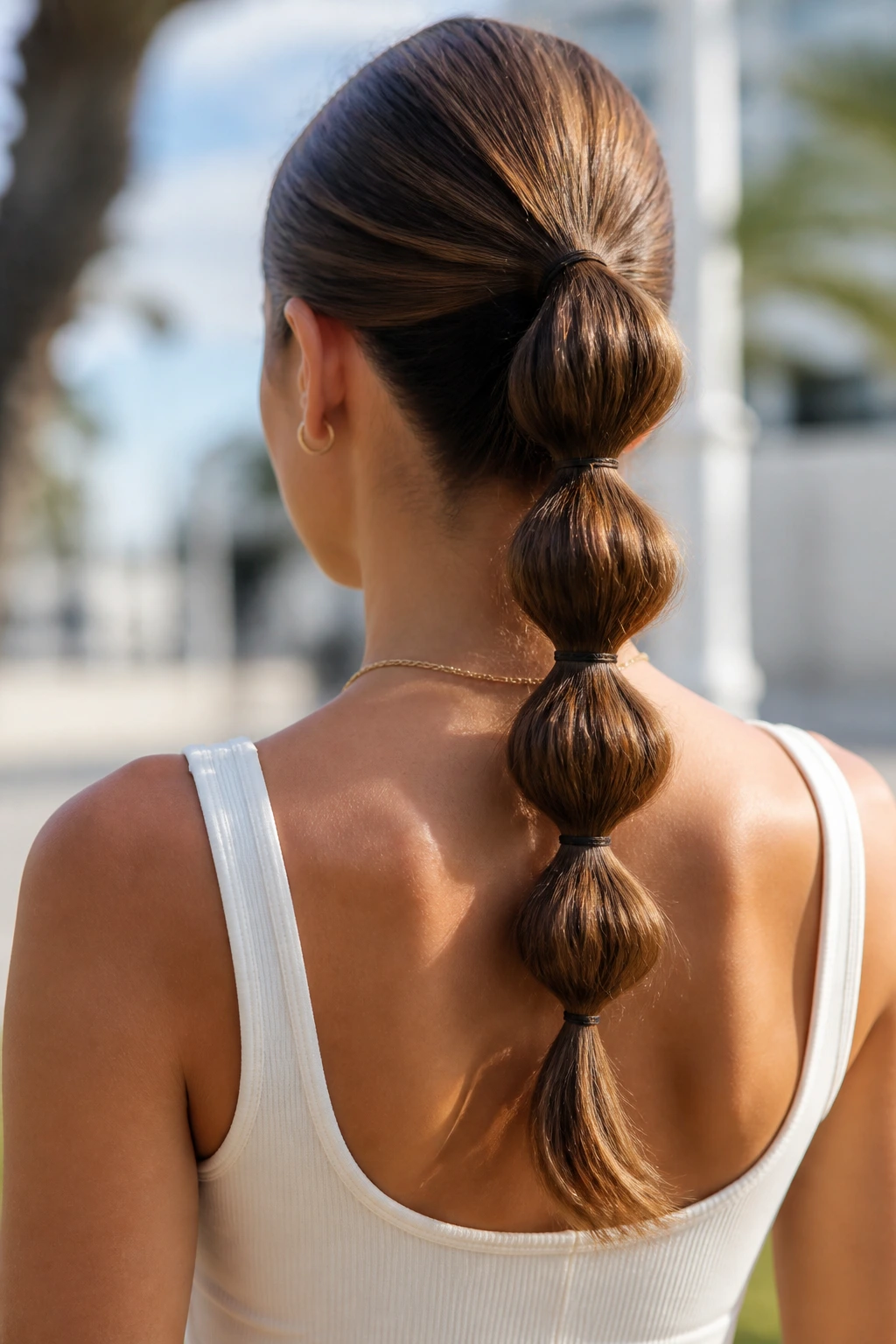 Back of head with bubble ponytail showing segmented elastics.