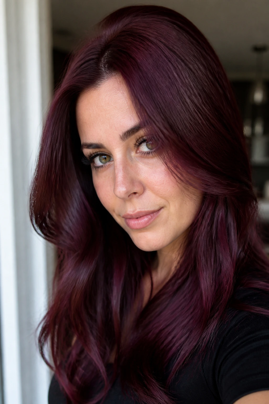 Close-up portrait of burgundy hair with rich red-violet gloss and shine