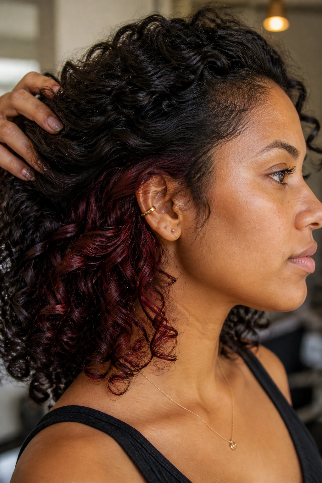 Burgundy hidden panels under a top layer of curls