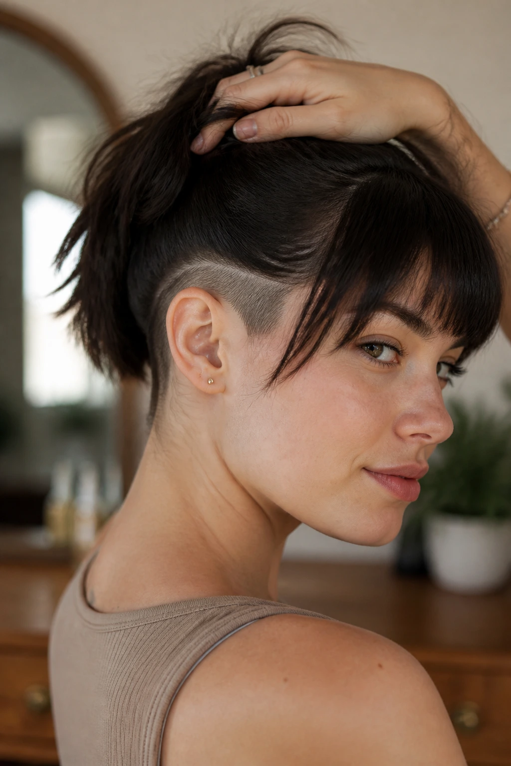 Front three-quarter portrait of a real woman with buzzed nape and fringe