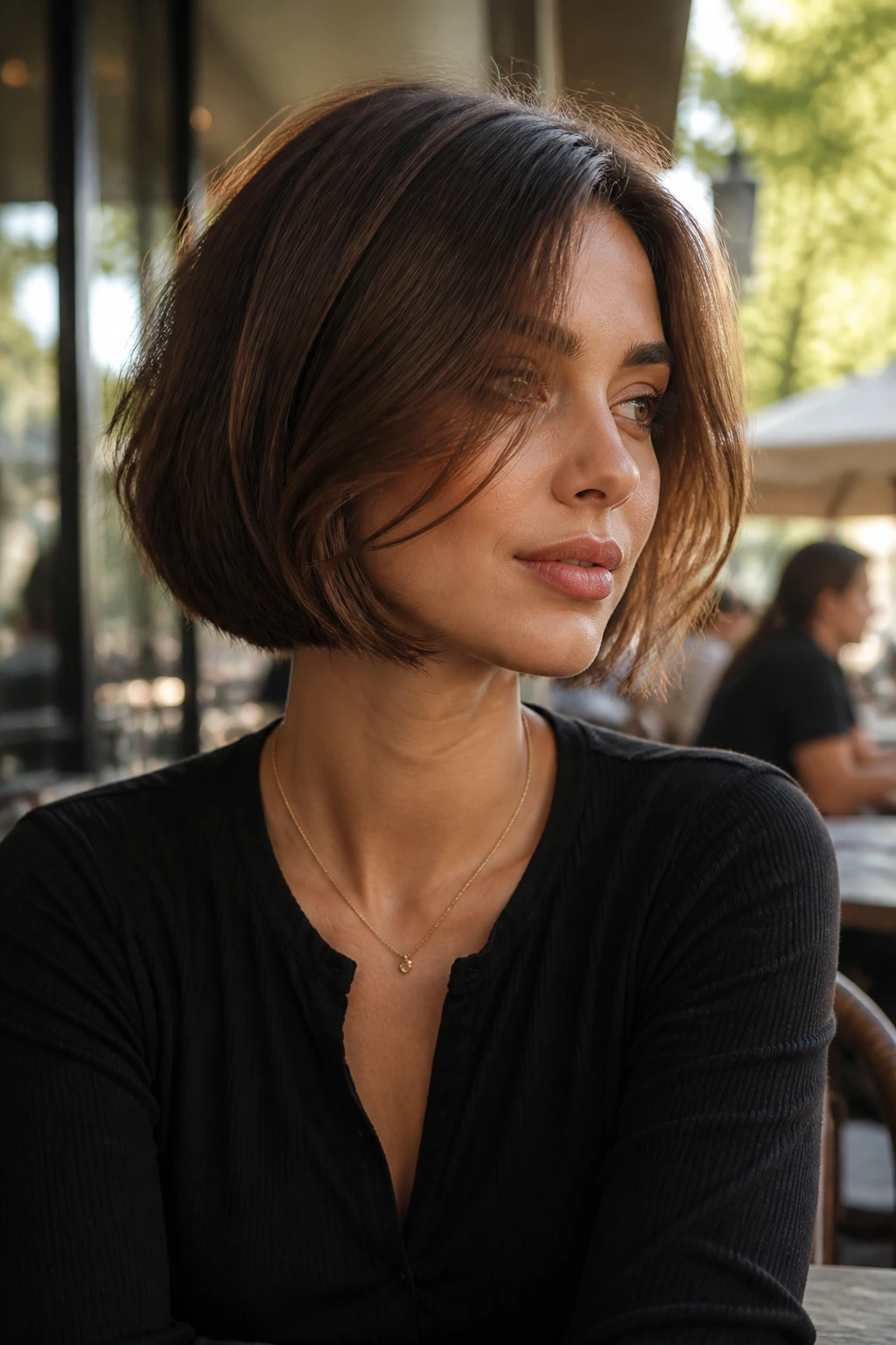 Medium close-up portrait of a real person with chin-length bob and swingy front pieces.