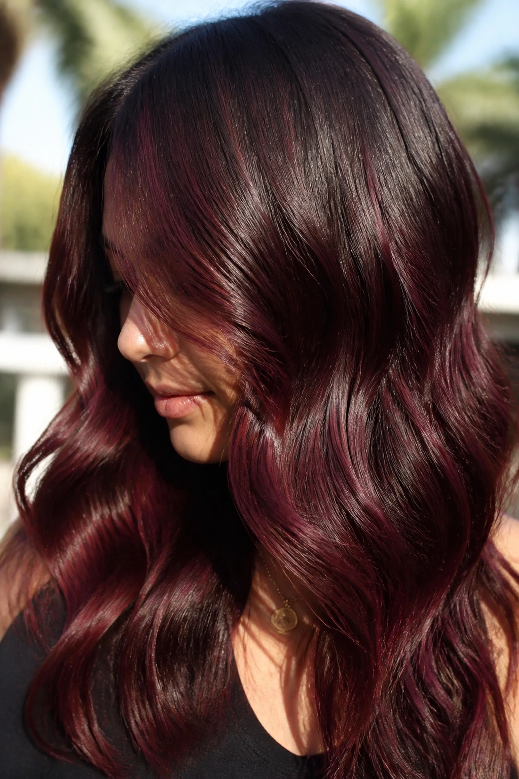 Wavy hair with chocolate cherry dimension burgundy threads
