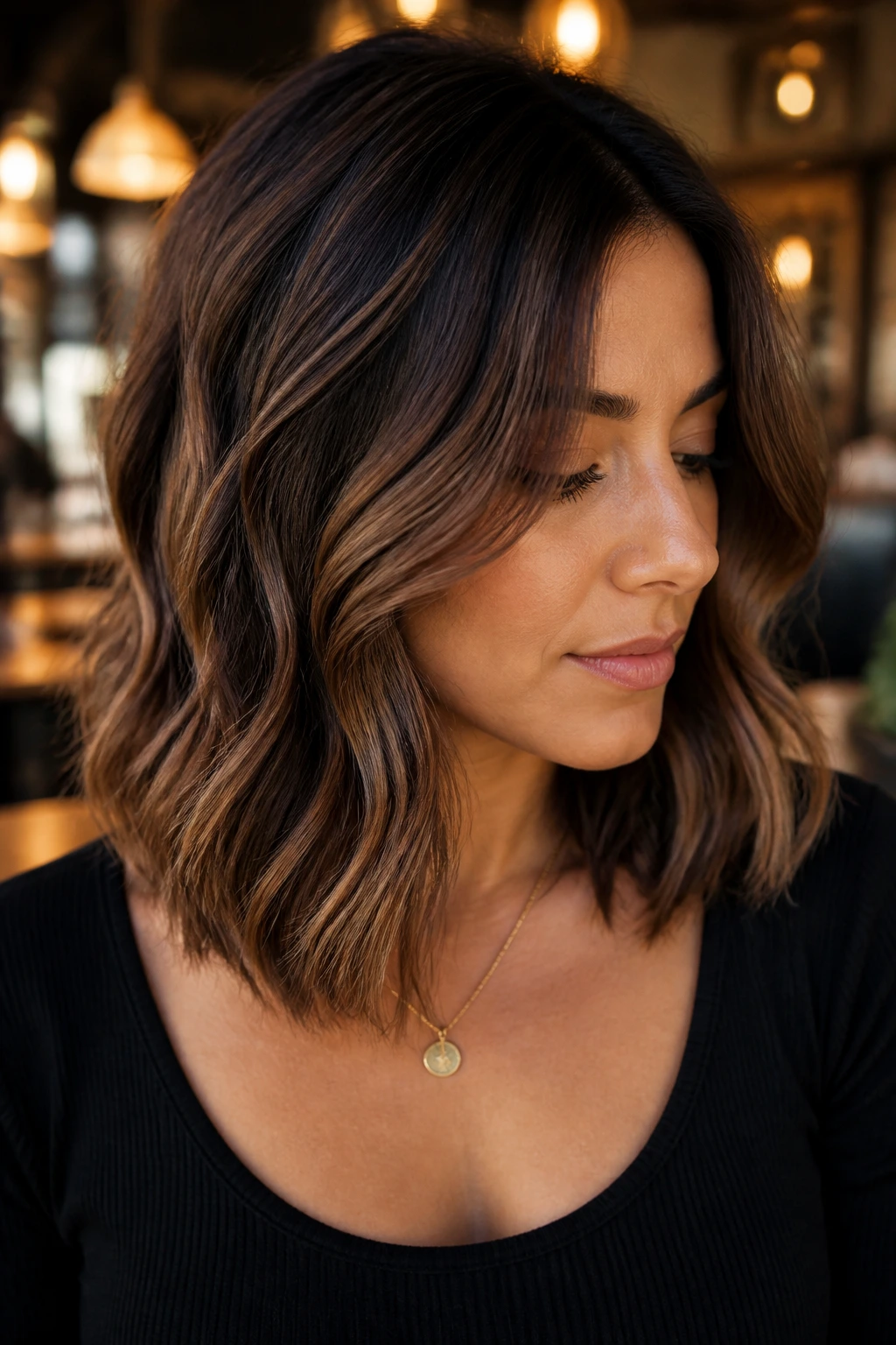Close-up of a real woman with chocolate mocha shadow lights balayage