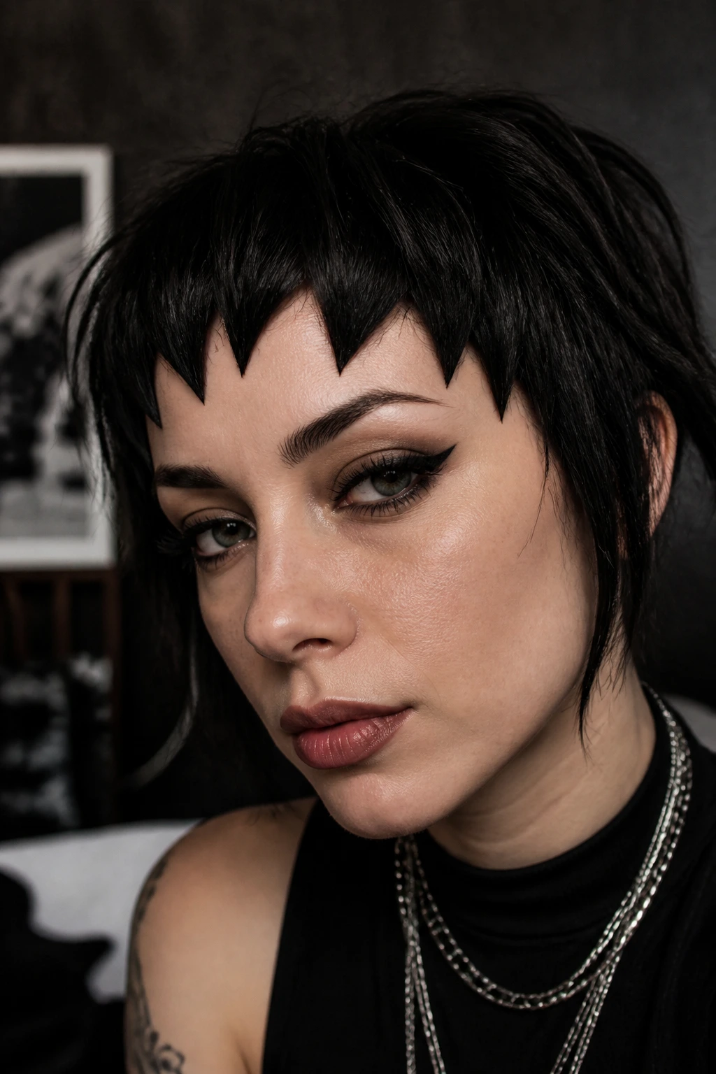 Close-up of a real person with chopped hex fringe on goth hair