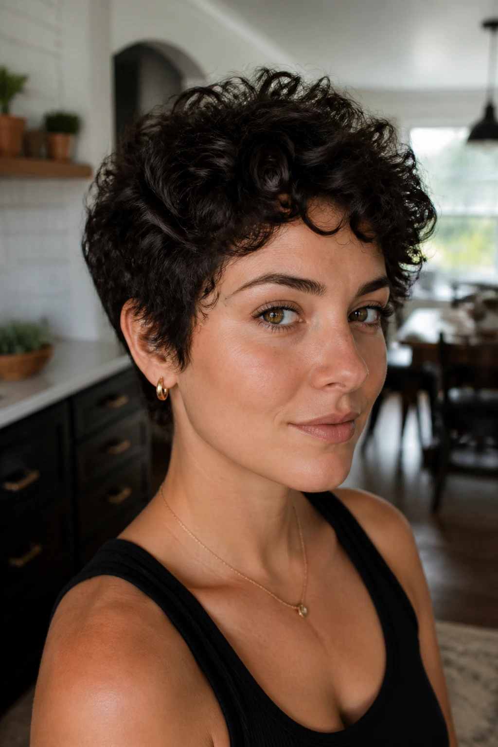 Close-up of real person with choppy crop and crown-length curls