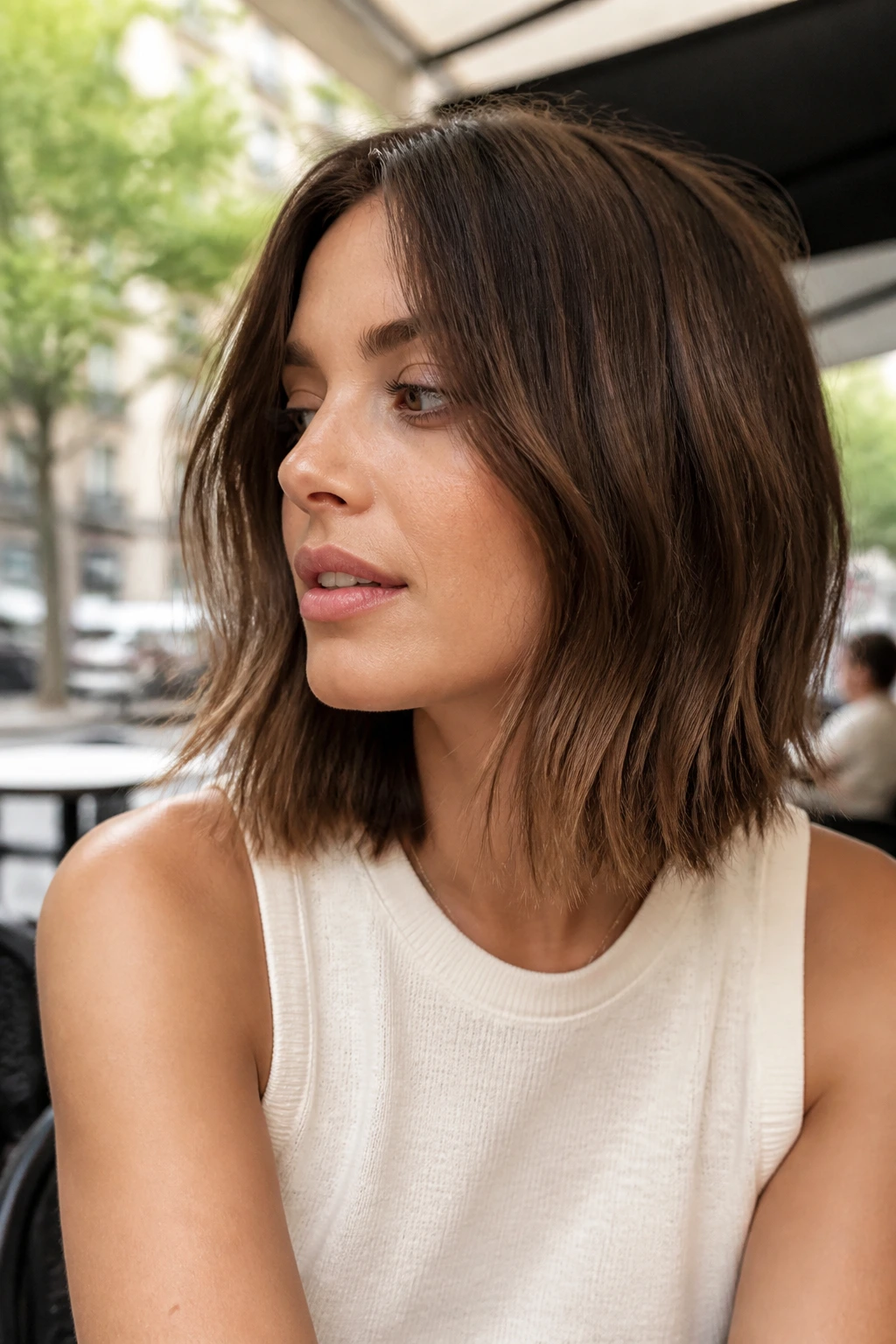 Close-up of a real woman with a choppy lob and textured ends