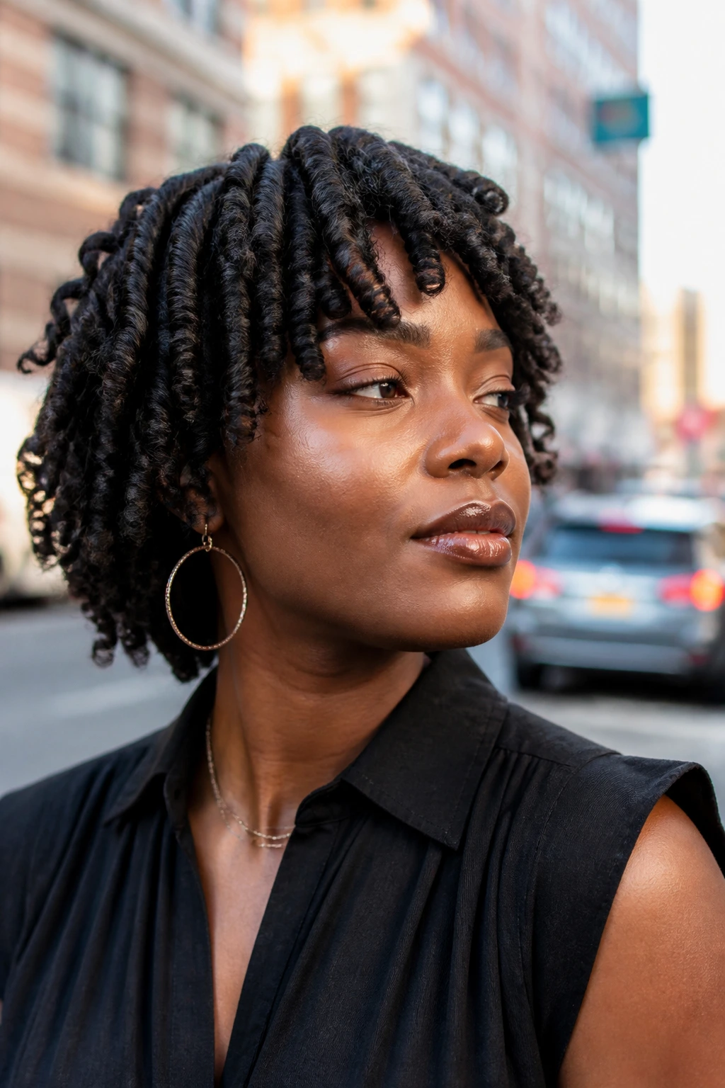 Close-up of a real woman with chunky two-strand twists and spiral ends