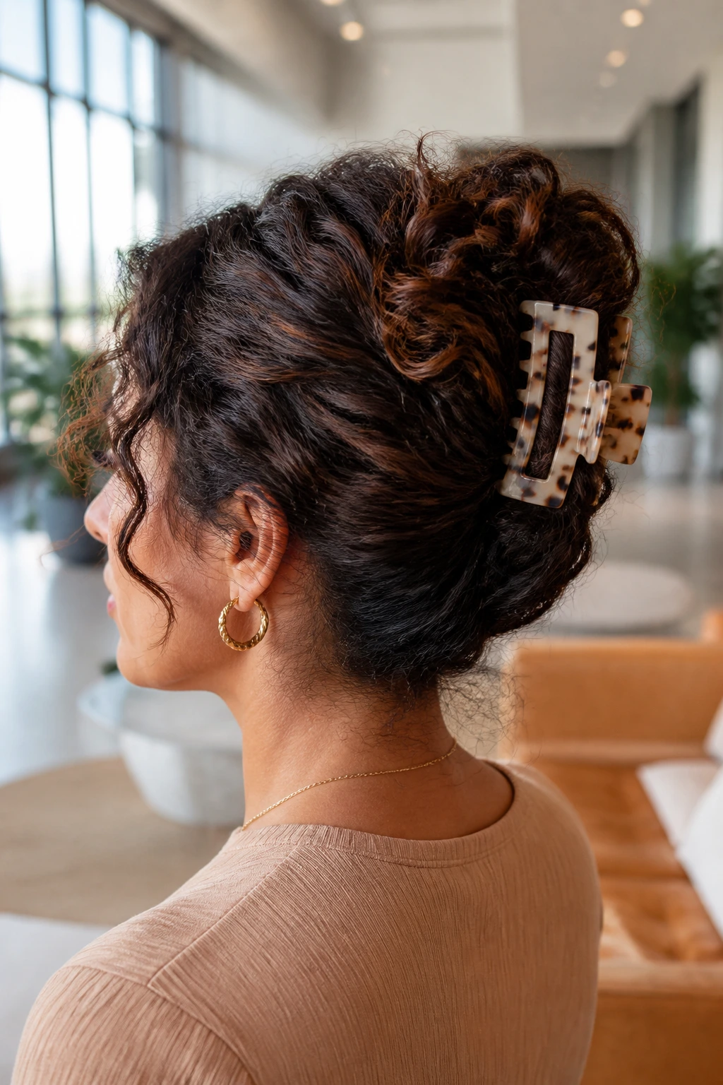 Close-up of real woman with claw-clip French twist hairstyle