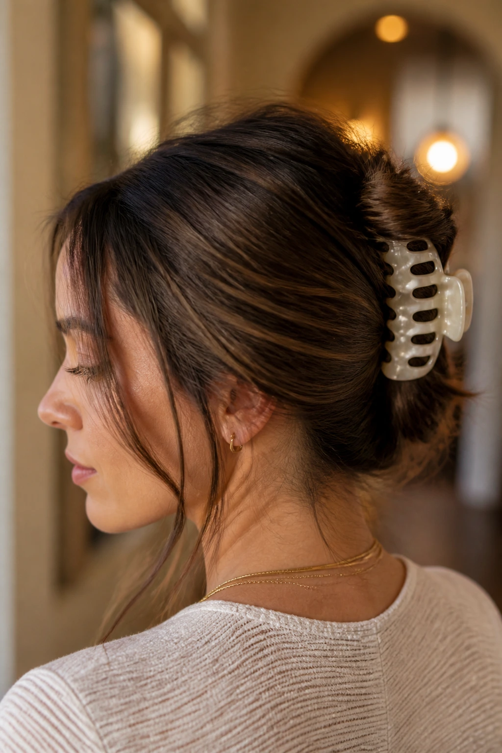 Real woman with claw clip French twist for quick long-hair days.