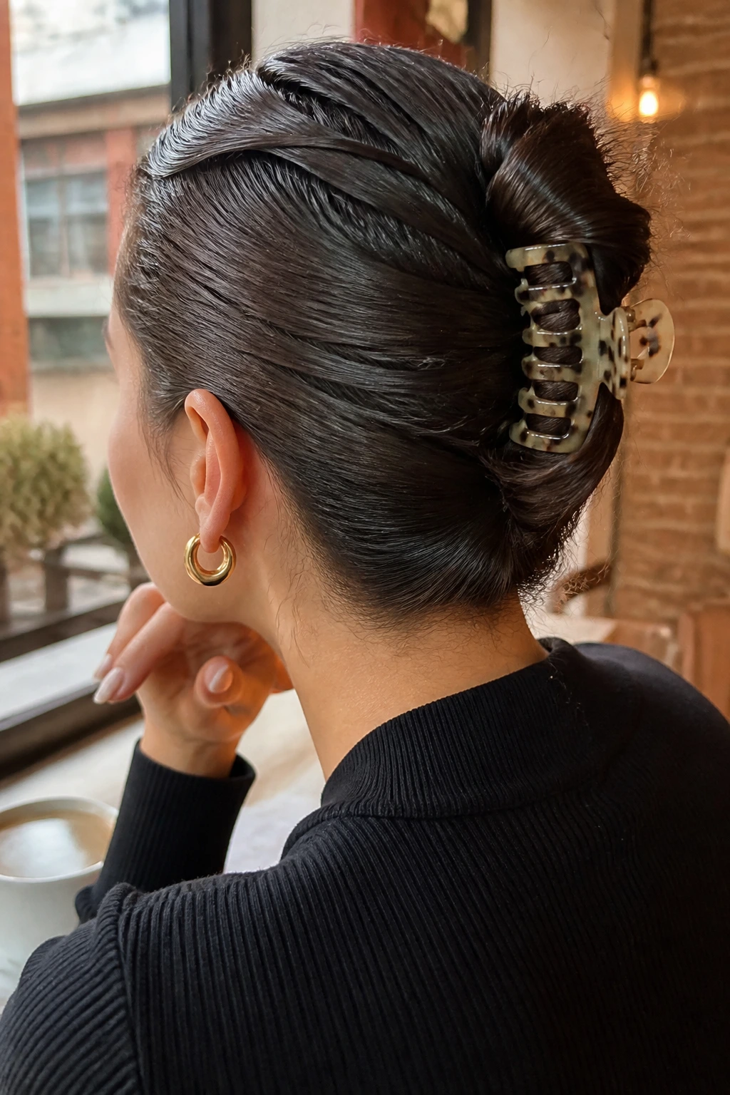 Close-up of a real woman's claw-clip twist hairstyle