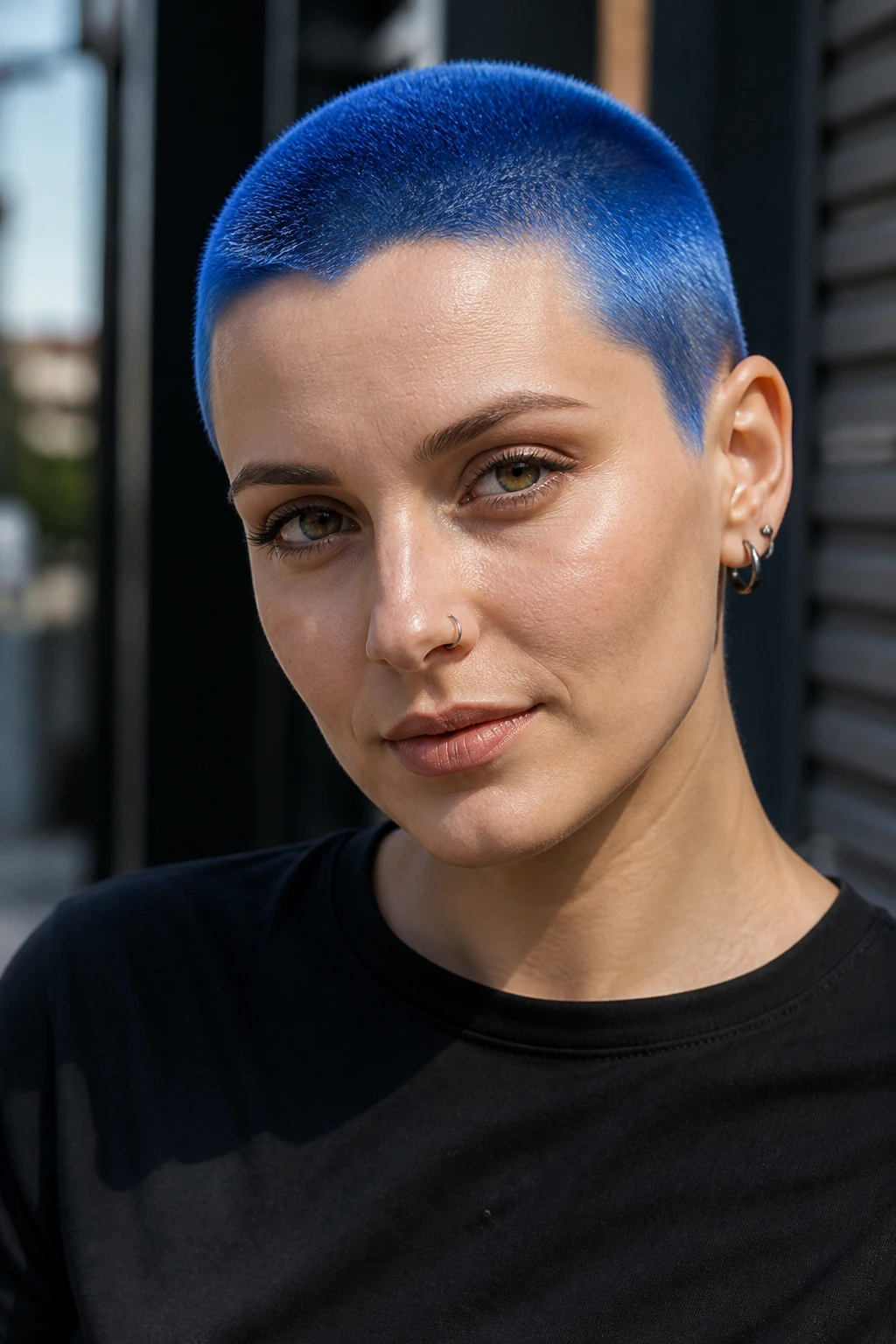 Close-up portrait of a real woman with cobalt blue buzz cut against an urban backdrop