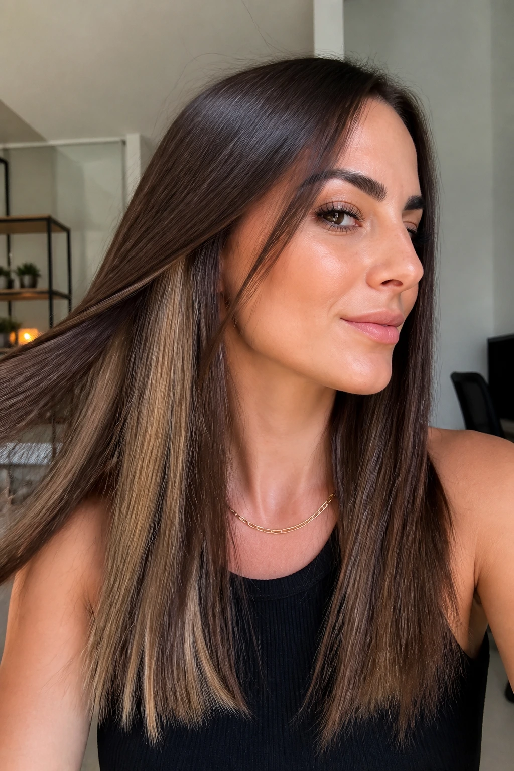 Real woman with cocoa brown hair and peekaboo panels revealed by movement