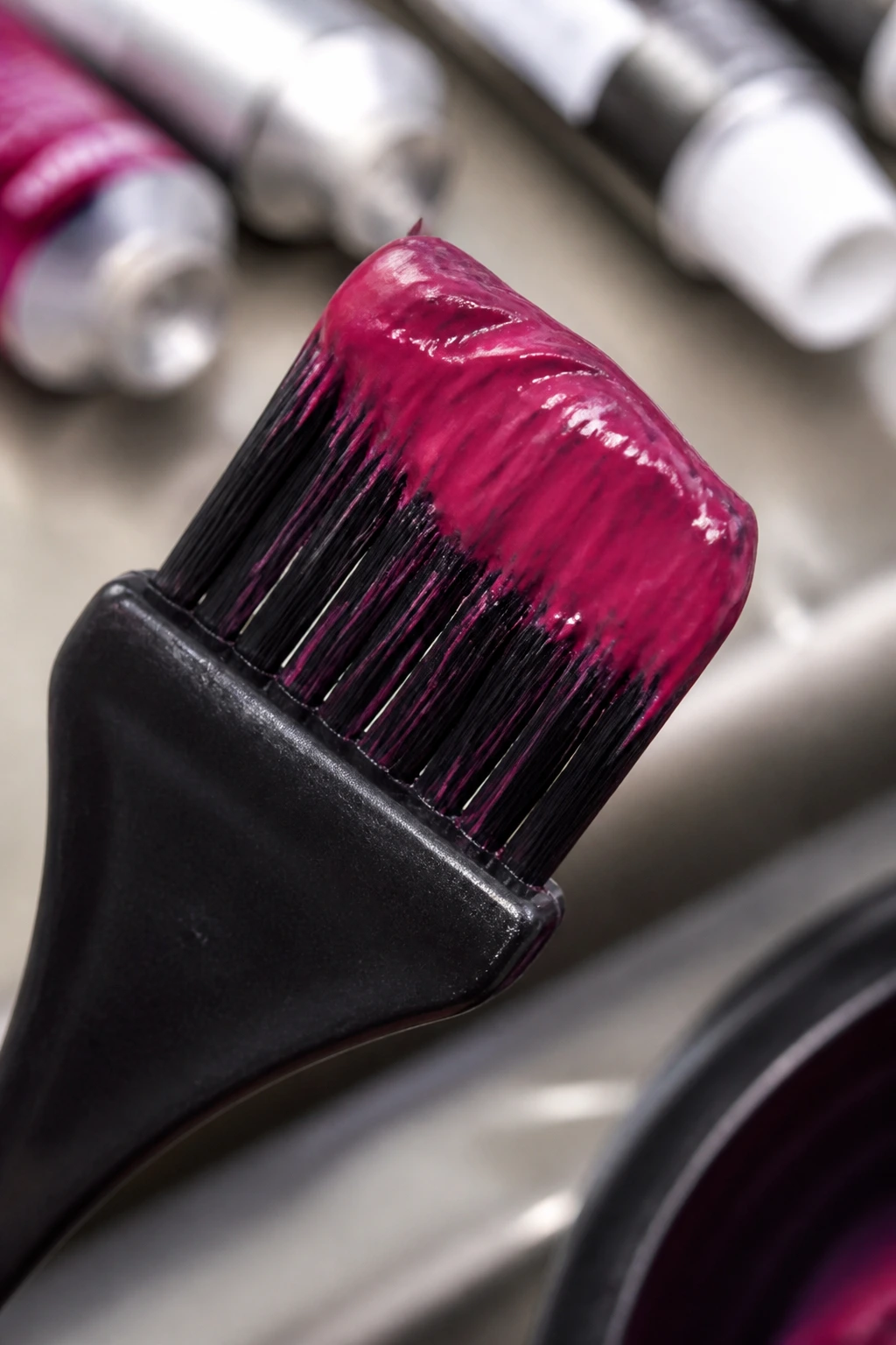 Macro close-up of a tint brush with dye on bristles