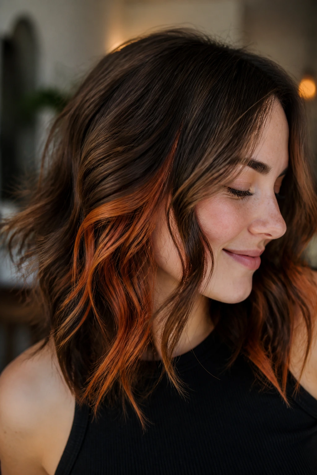 Hair showing copper peekaboo pieces under the top layer.