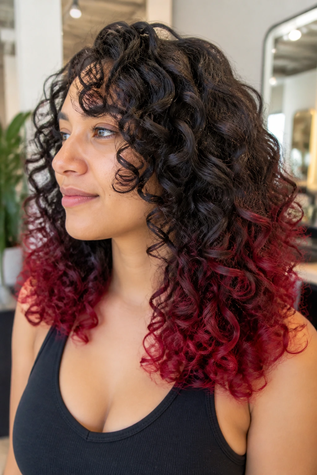 Close-up of curly hair with crimson dip ends on a real person