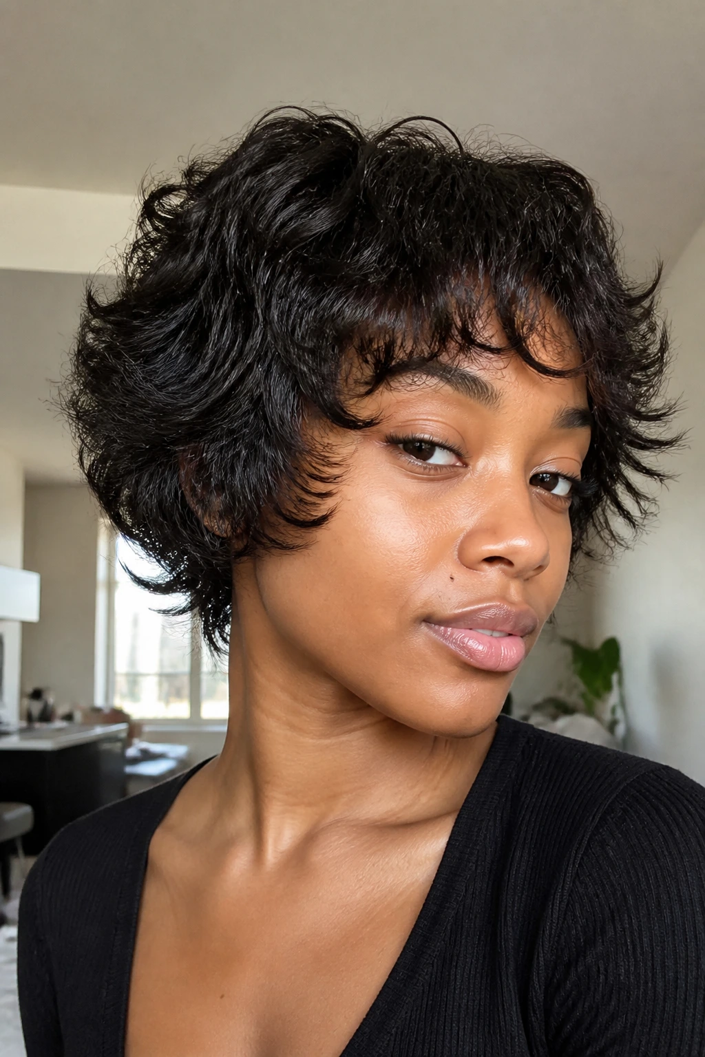 Close-up of a Black woman with cropped flipped-layer shag