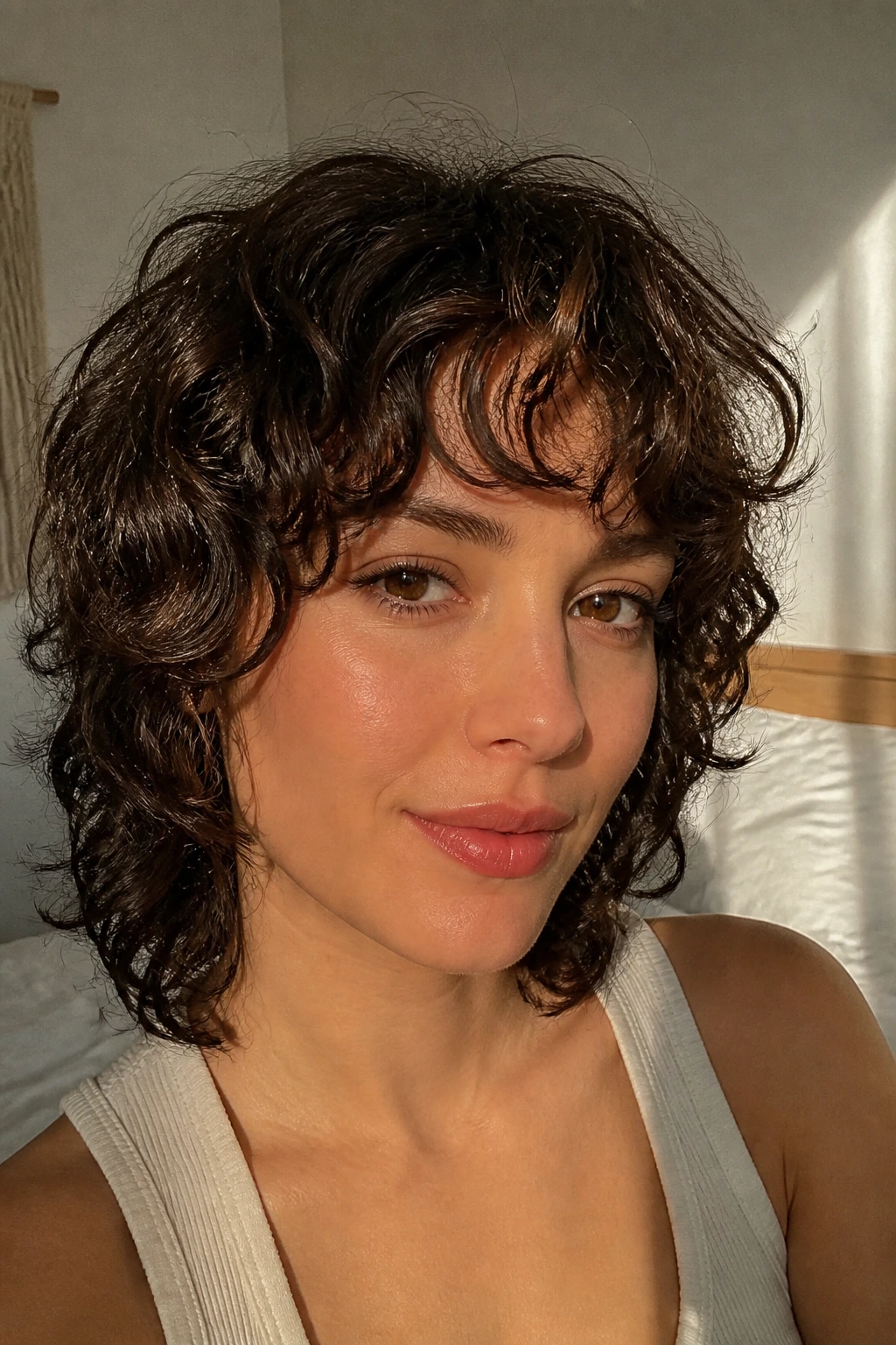 Real person with curly French shag and curtain fringe in natural light.