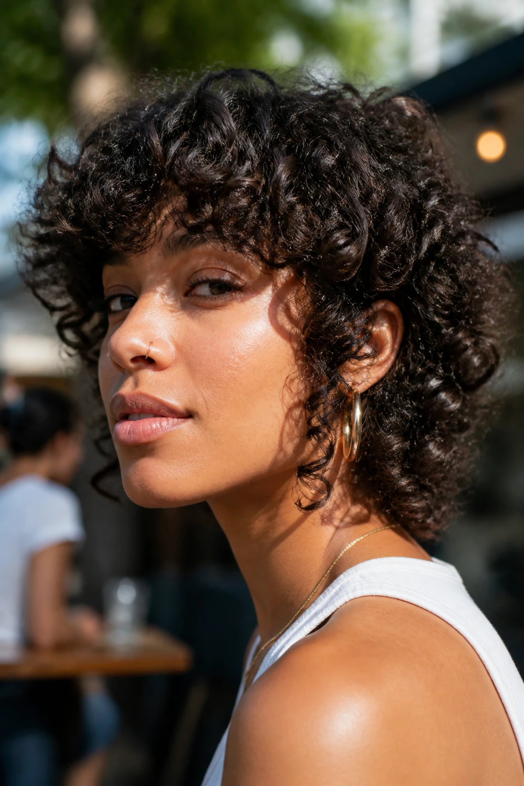 Close-up of real person with curly shag and long sideburns