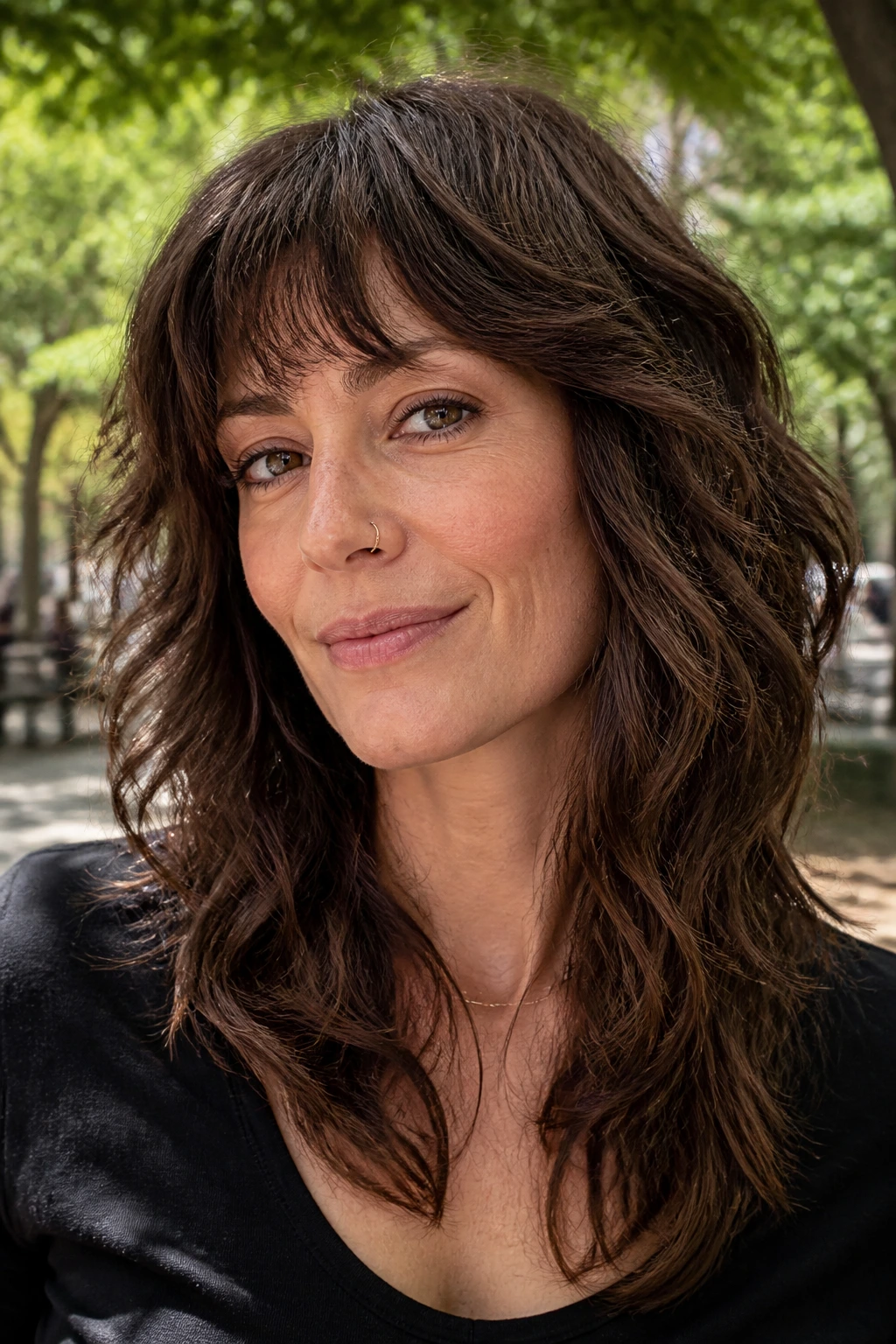 Close-up of dense hair styled in a de-bulked shag with inner layers.