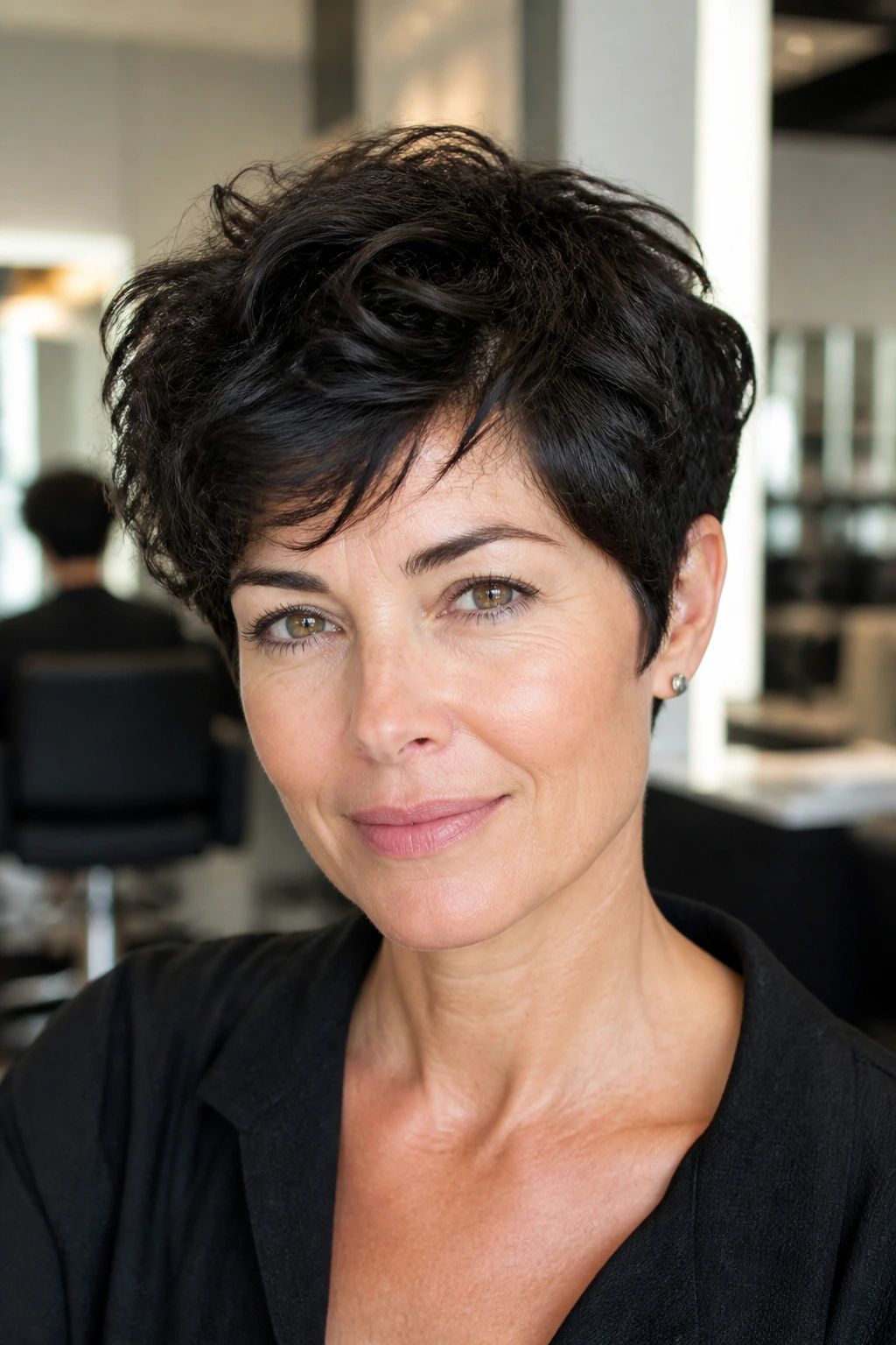 Close-up portrait of a real woman with de-bulked thick-hair pixie in a modern salon