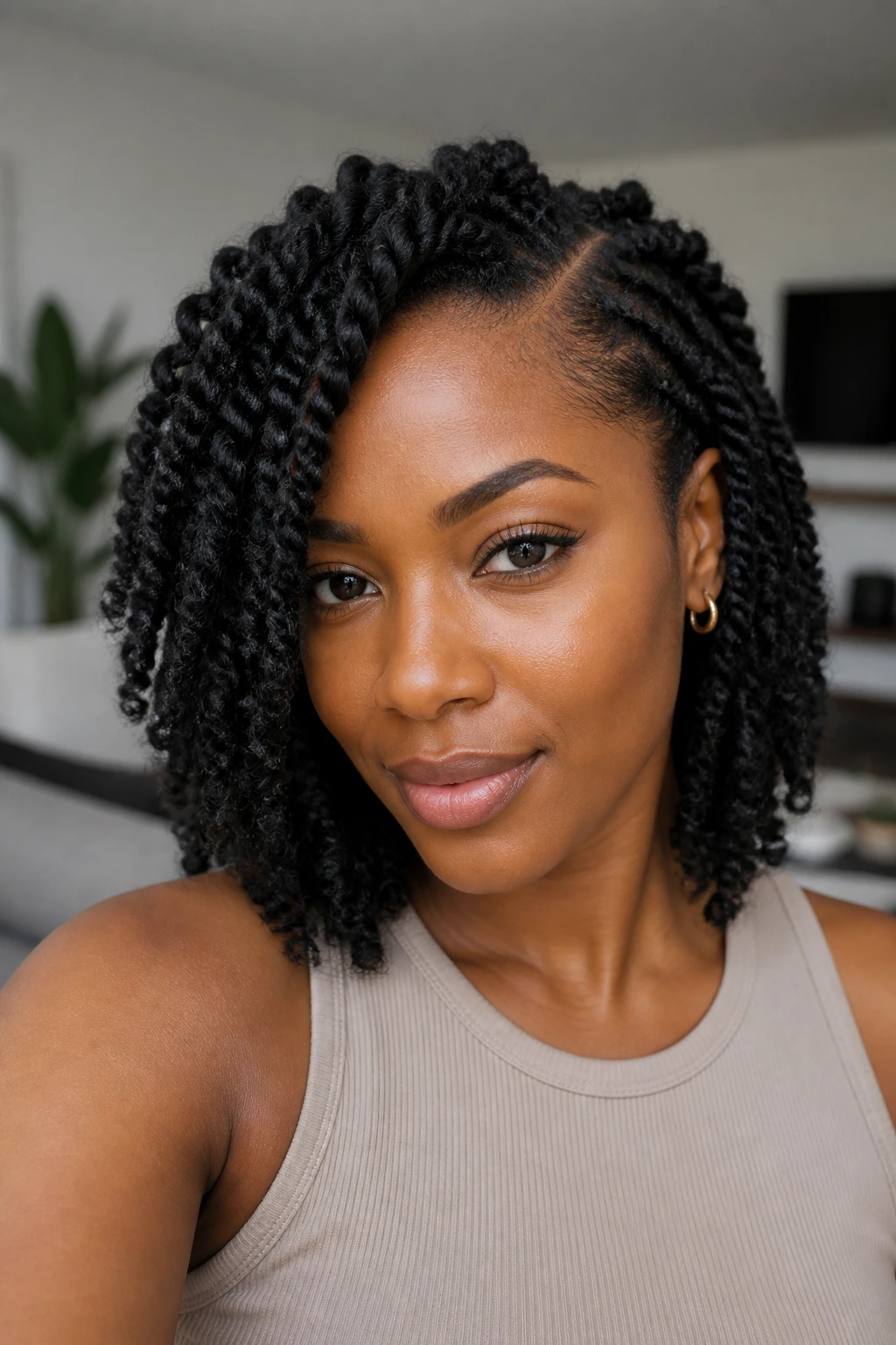 Close-up of a real woman with a deep side-part and spring twists