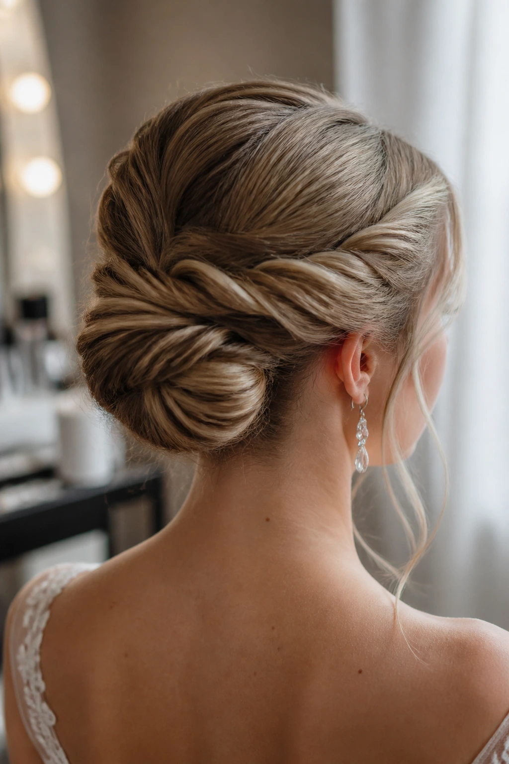 Close-up of Double-Twist Bun on a real bride with two twists meeting in back