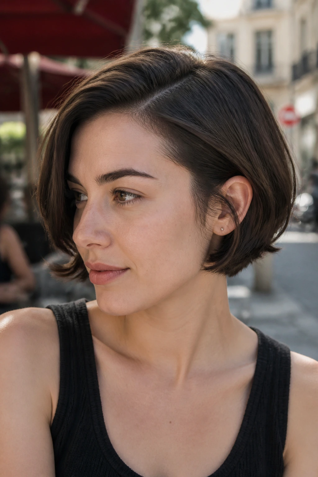 Real person with ear-grazing French bob and deep side part