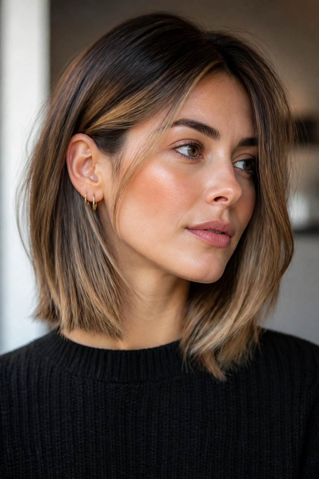 Portrait of a real person with ear tuck and soft face-framing highlights